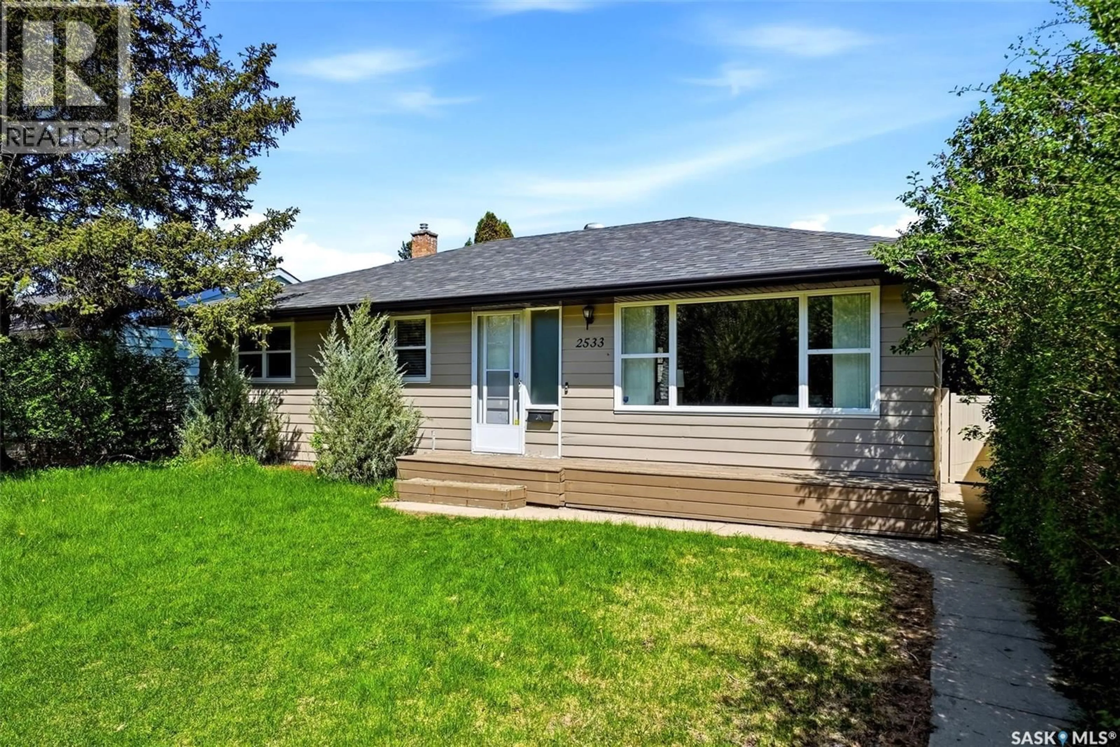 Home with vinyl exterior material, street for 2533 PASQUA STREET, Regina Saskatchewan S4S0M3