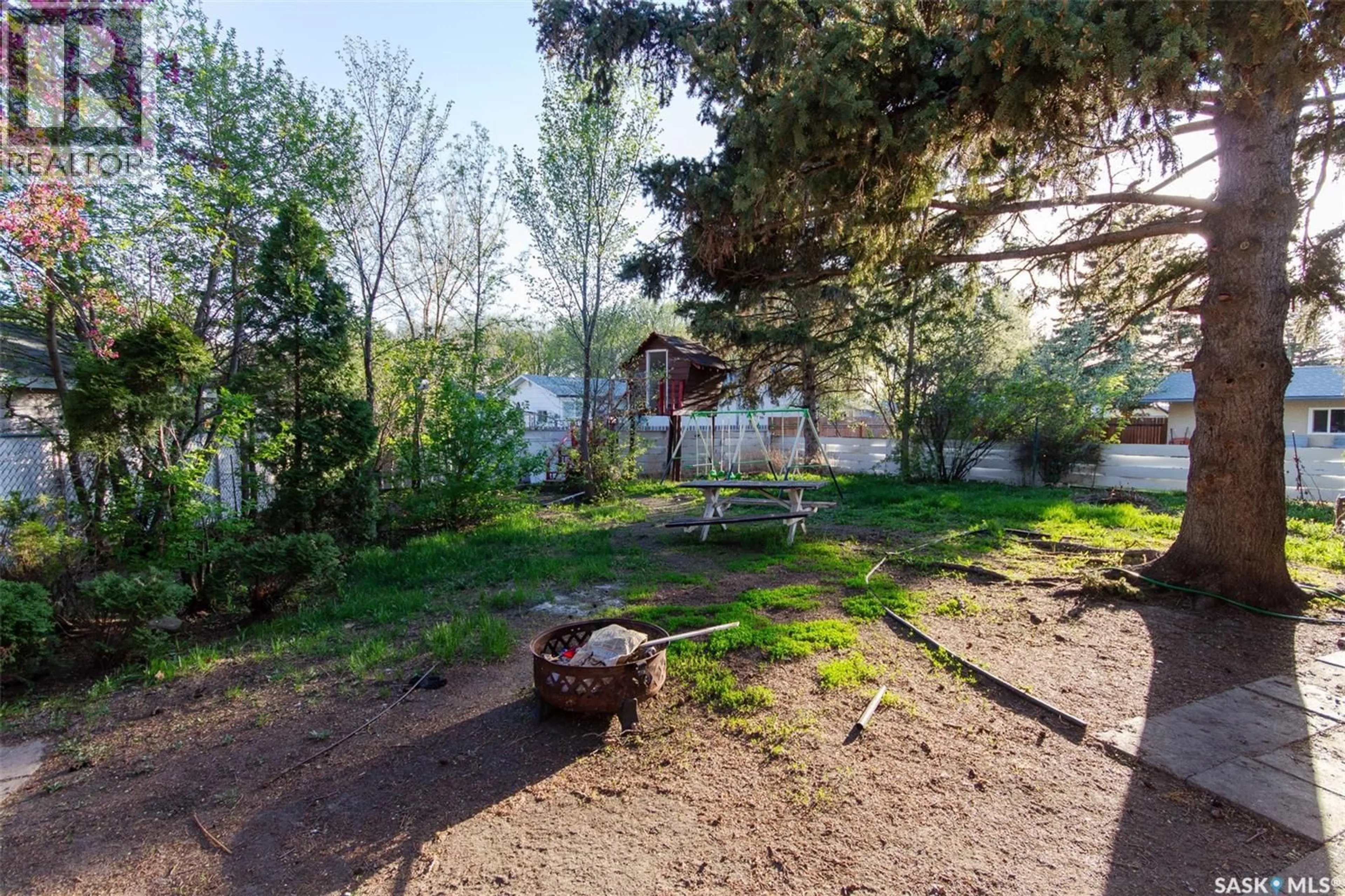 Patio, forest/trees view for 9704 97TH DRIVE, North Battleford Saskatchewan S9A0L4