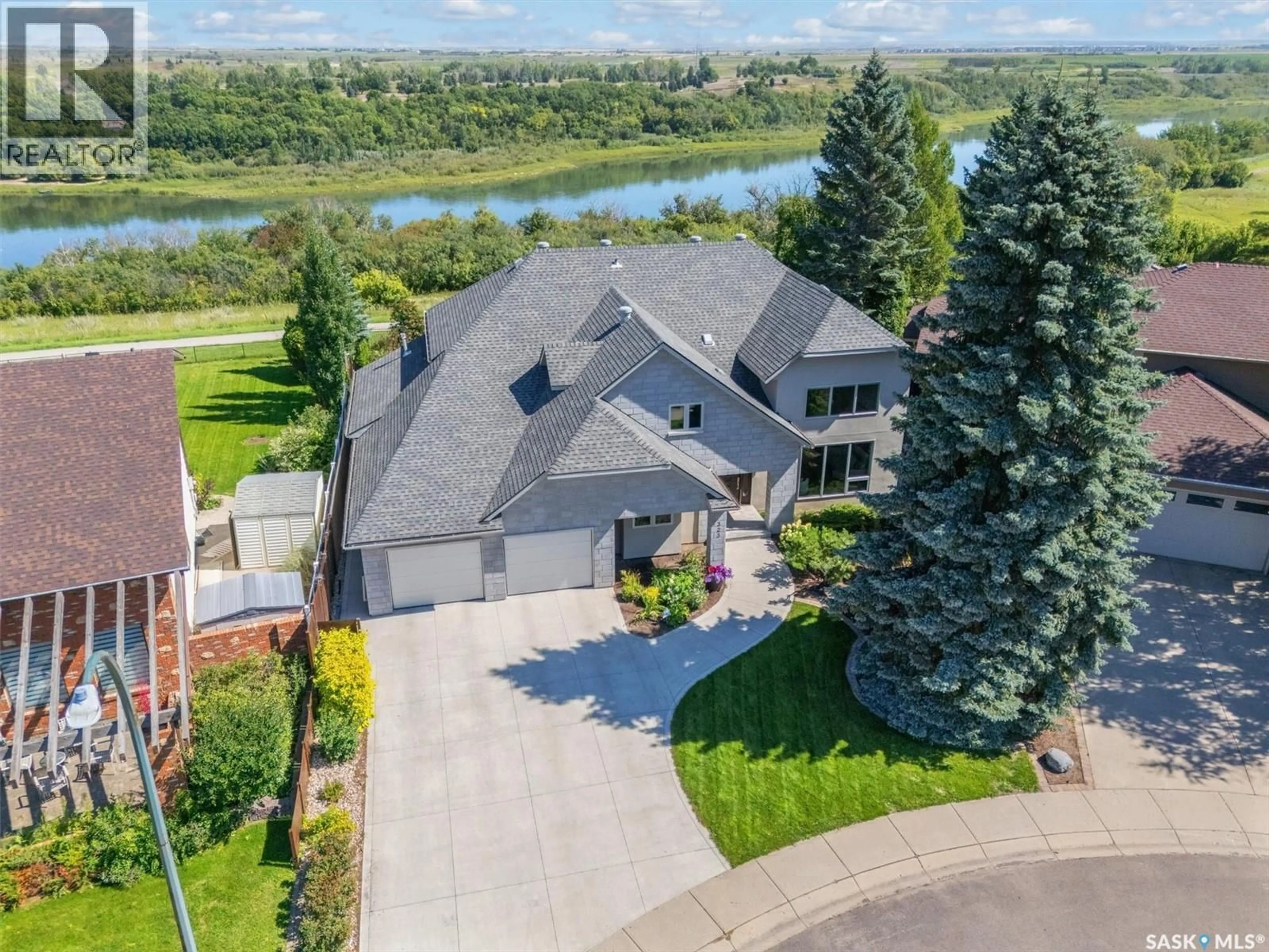 A pic from outside/outdoor area/front of a property/back of a property/a pic from drone, water/lake/river/ocean view for 323 MALLIN CRESCENT, Saskatoon Saskatchewan S7K7X2