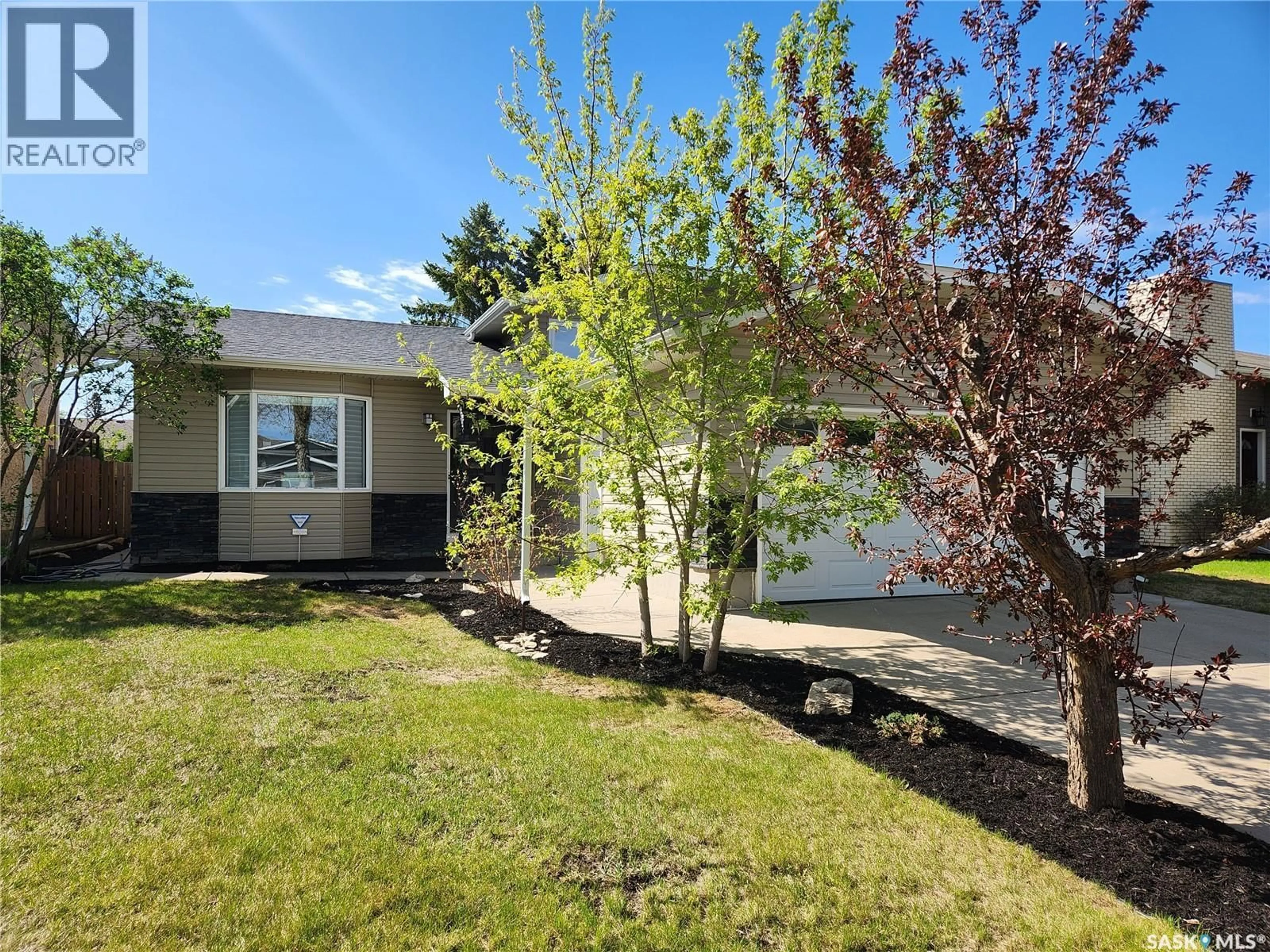 Home with vinyl exterior material, street for 223 ADILMAN DRIVE, Saskatoon Saskatchewan S7K7S1