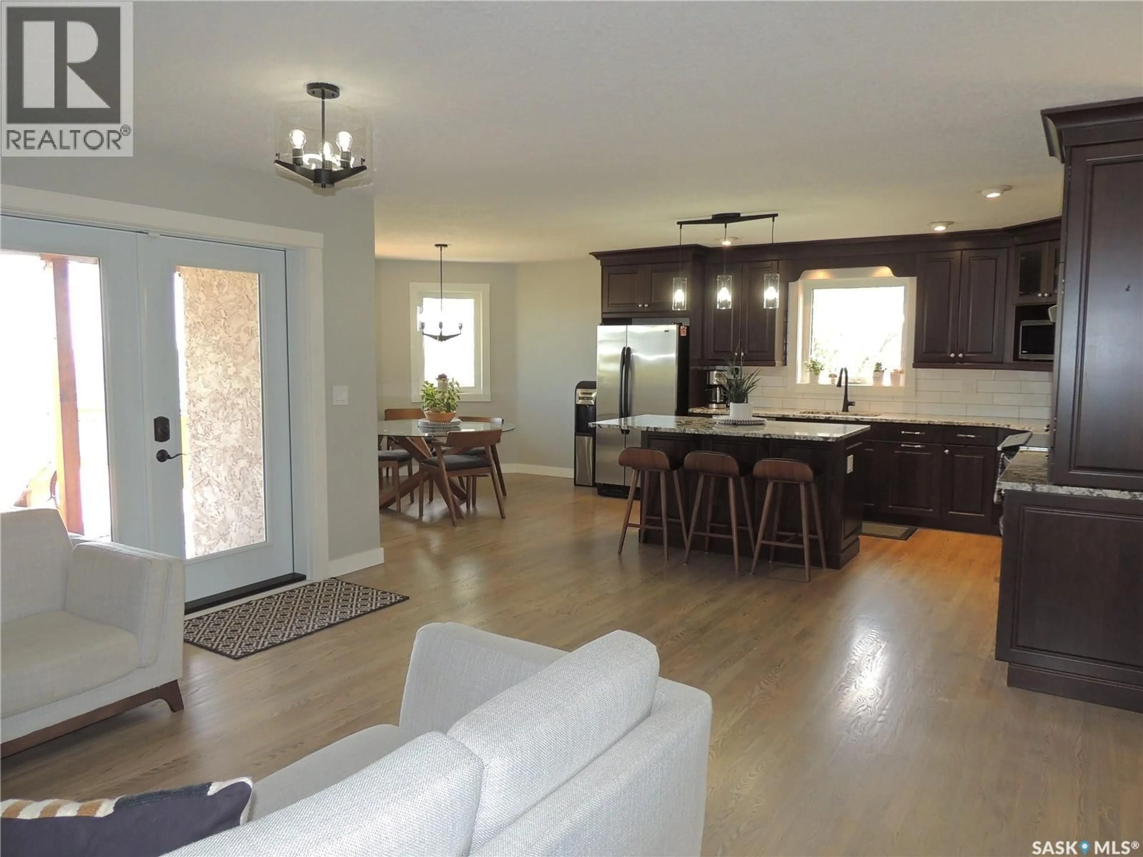 Open concept kitchen, wood/laminate floor for YERGENS ACREAGE, Estevan Rm No. 5 Saskatchewan S4A2A7