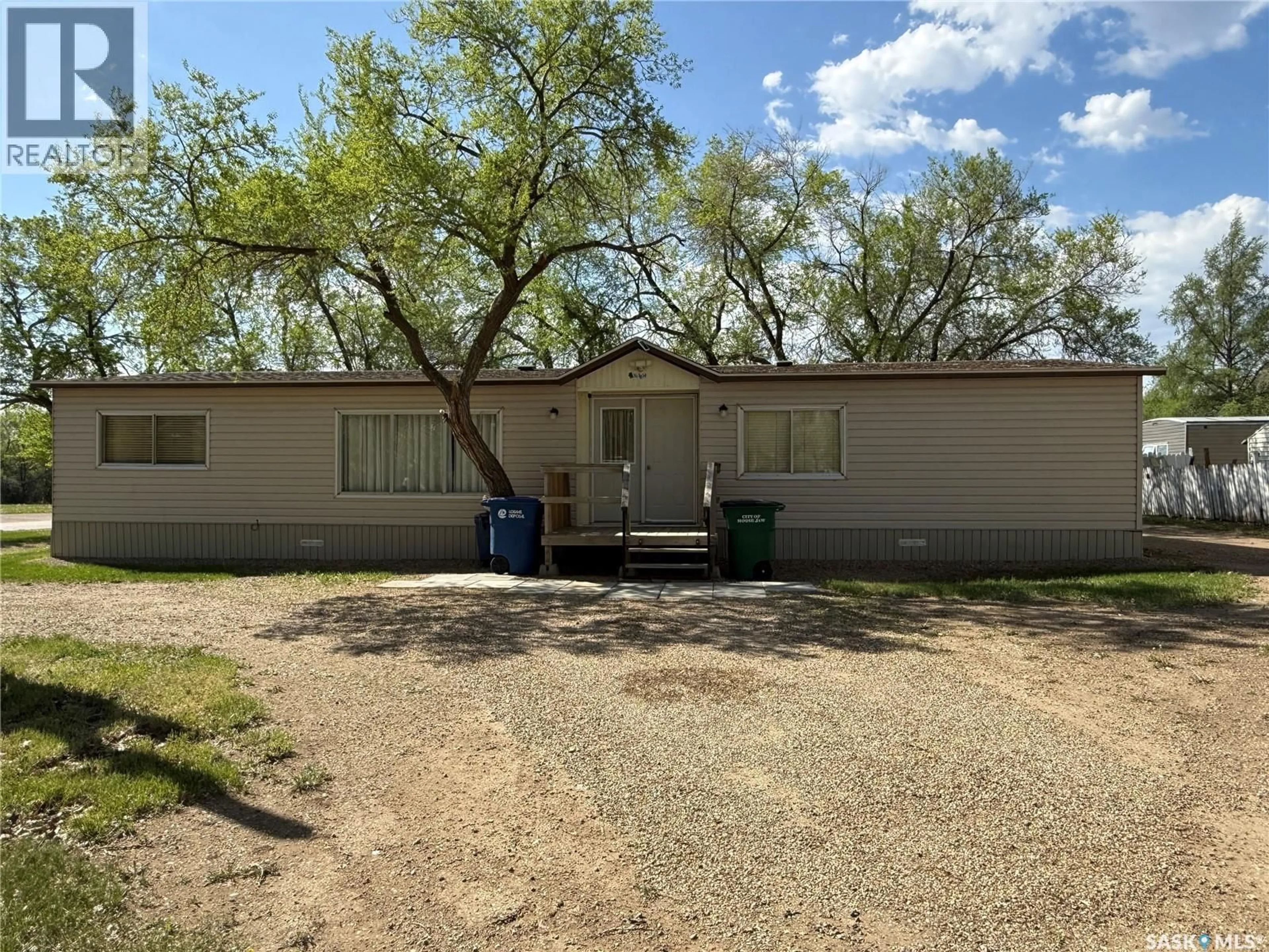 A pic from outside/outdoor area/front of a property/back of a property/a pic from drone, street for G1 - 1455 9TH AVENUE, Moose Jaw Saskatchewan S6J1C6