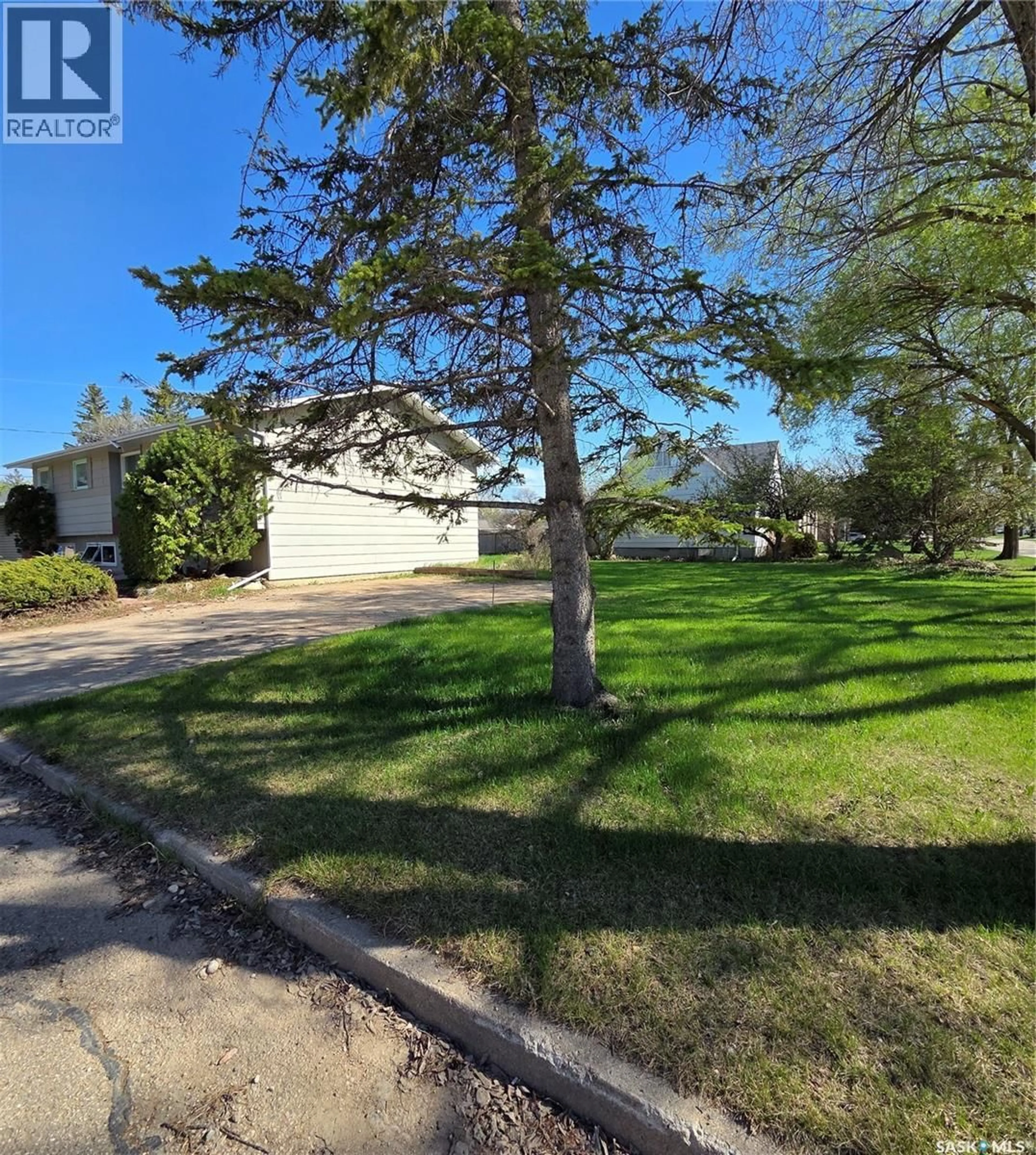 A pic from outside/outdoor area/front of a property/back of a property/a pic from drone, street for 1308 98TH STREET, Tisdale Saskatchewan S0E1T0
