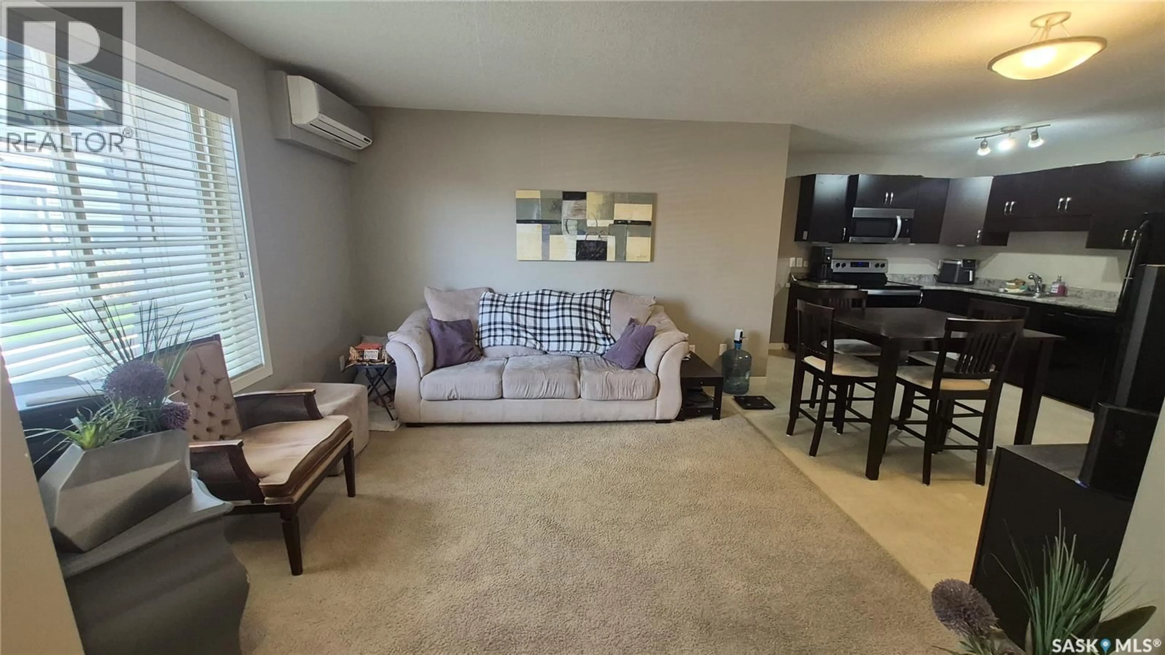 Living room with furniture, carpet floor for 5027 JAMES HILL ROAD, Regina Saskatchewan S4W0B9