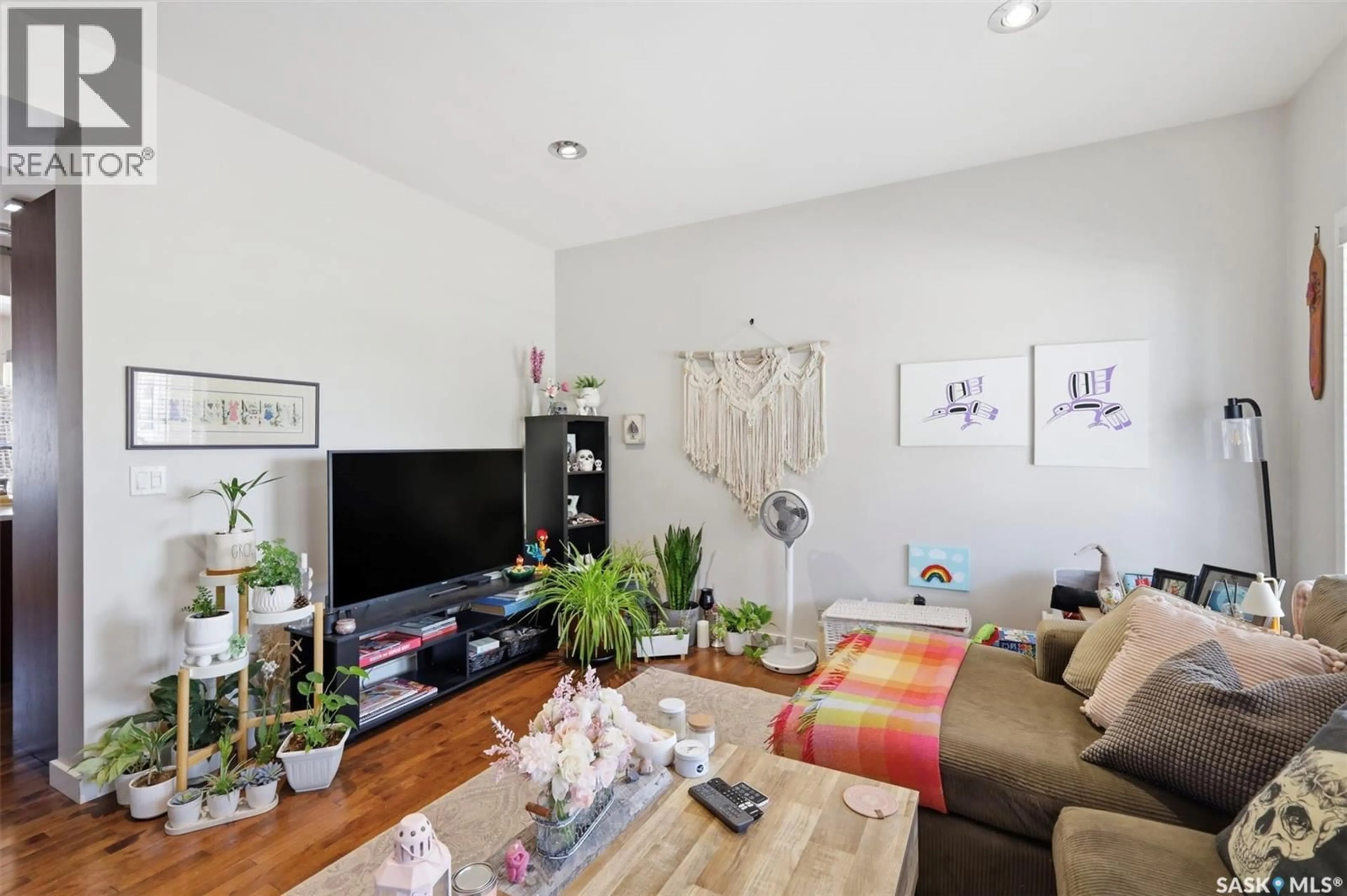 Living room with furniture, wood/laminate floor for 159 TWEED LANE, Saskatoon Saskatchewan S7V0K1