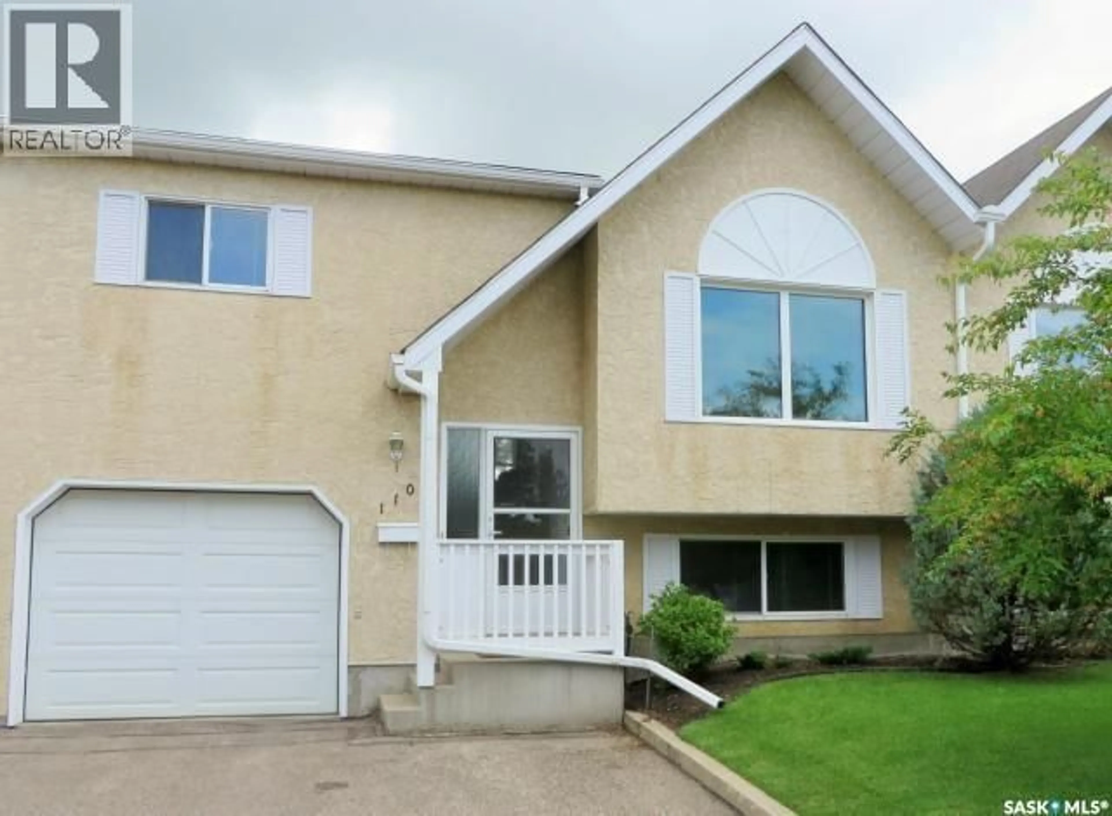Home with vinyl exterior material, street for 110 320 HERITAGE CRESCENT, Saskatoon Saskatchewan S7H5P4