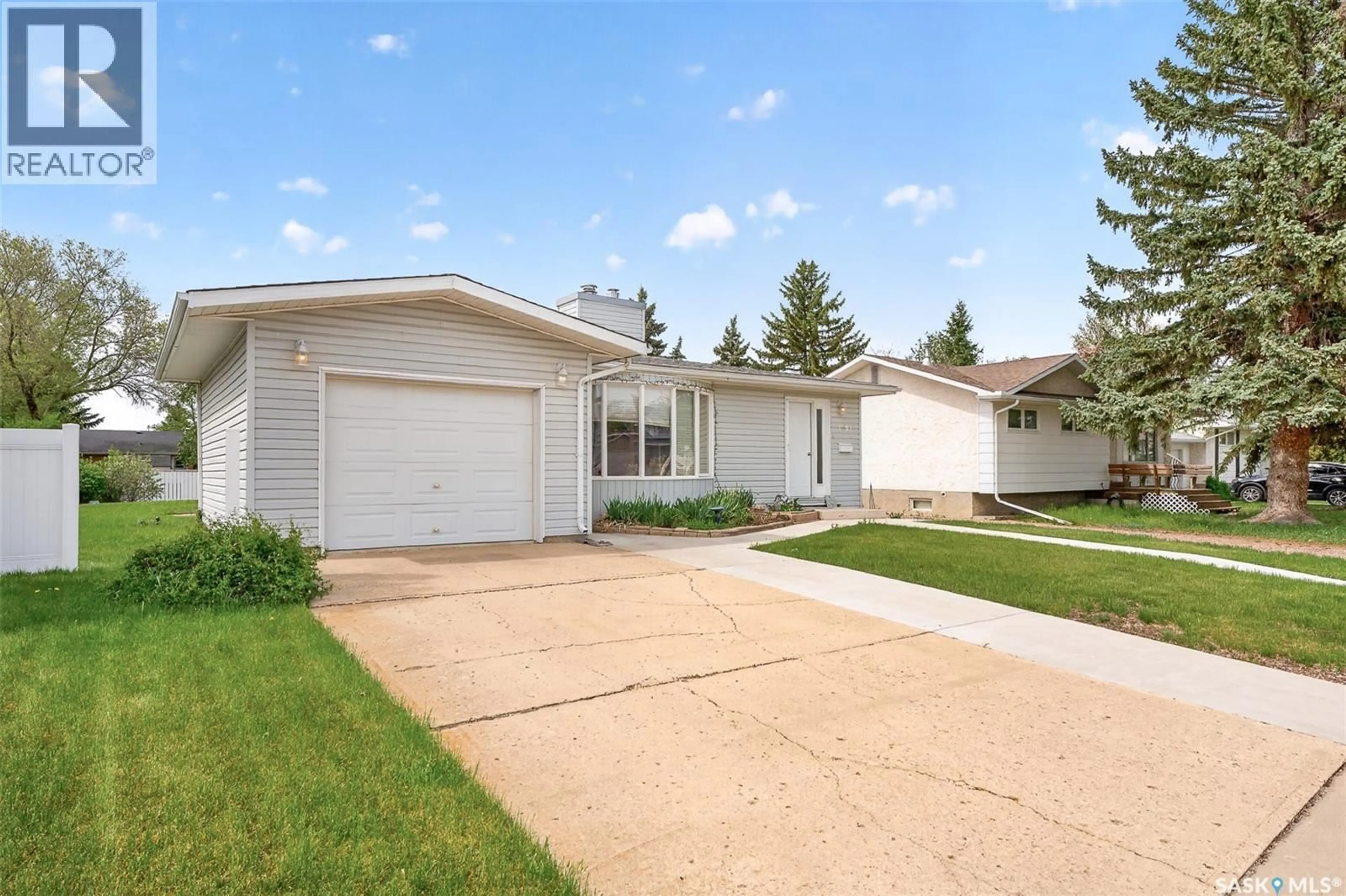Home with vinyl exterior material, street for 1381 PRINCE CRESCENT, Moose Jaw Saskatchewan S6H6E6