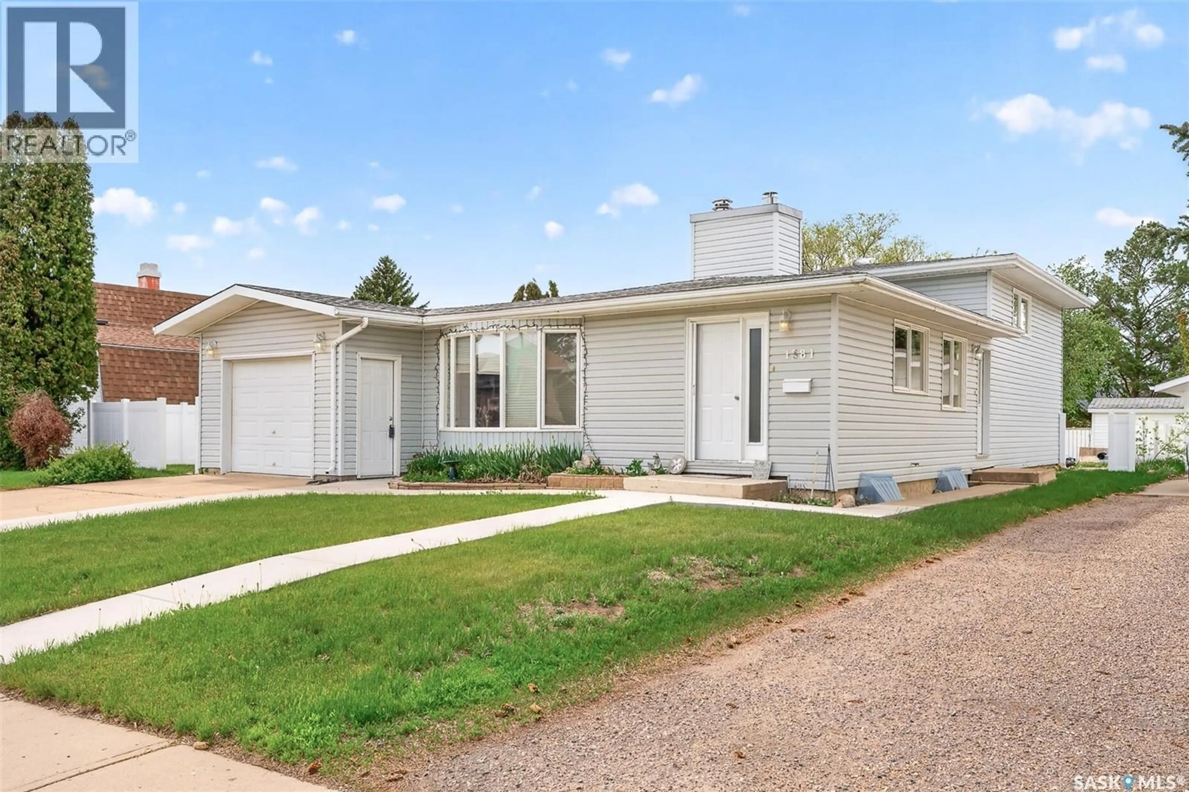 Home with vinyl exterior material, street for 1381 PRINCE CRESCENT, Moose Jaw Saskatchewan S6H6E6