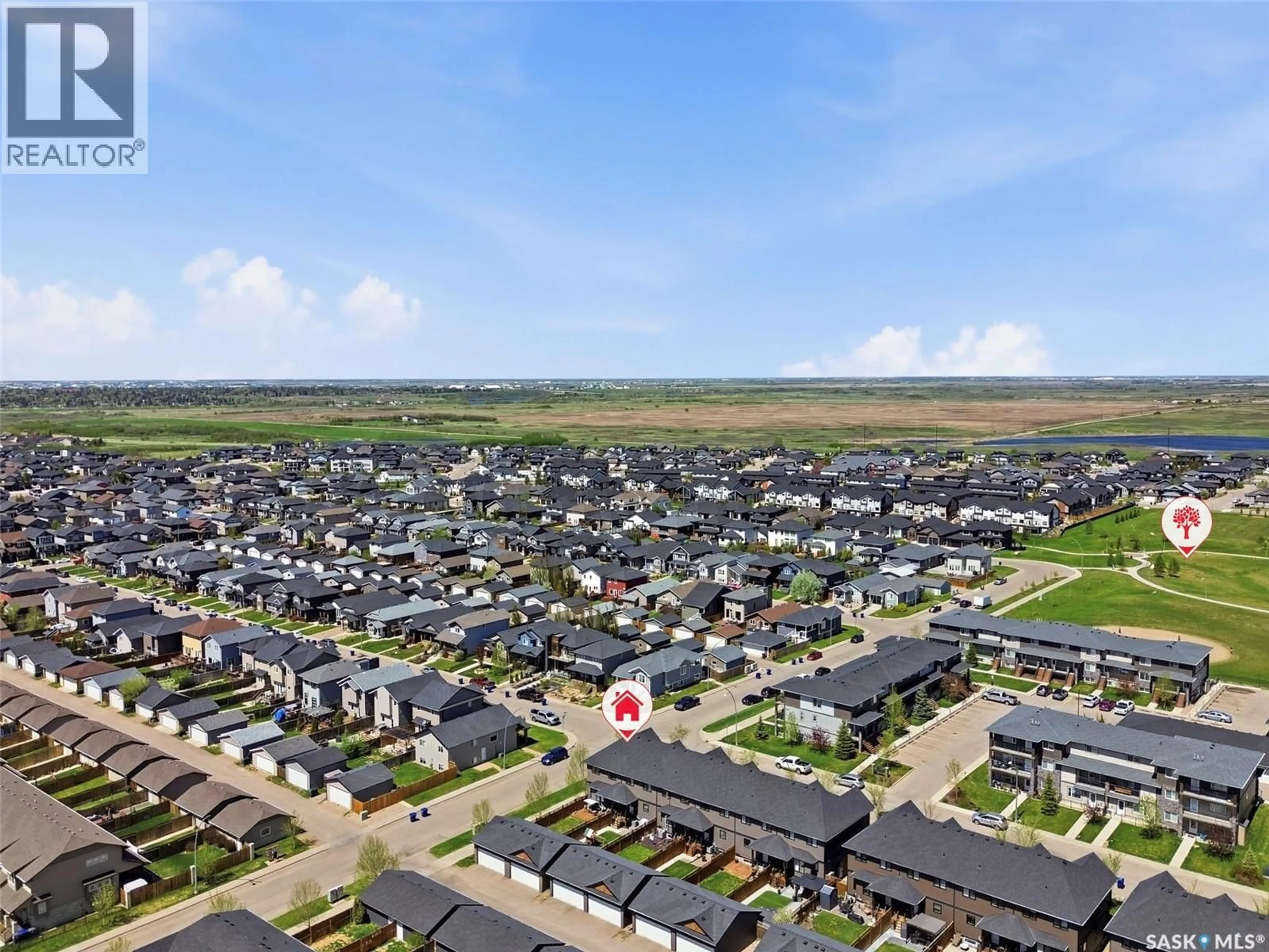 A pic from outside/outdoor area/front of a property/back of a property/a pic from drone, street for 201 RAJPUT WAY, Saskatoon Saskatchewan S7P0A5