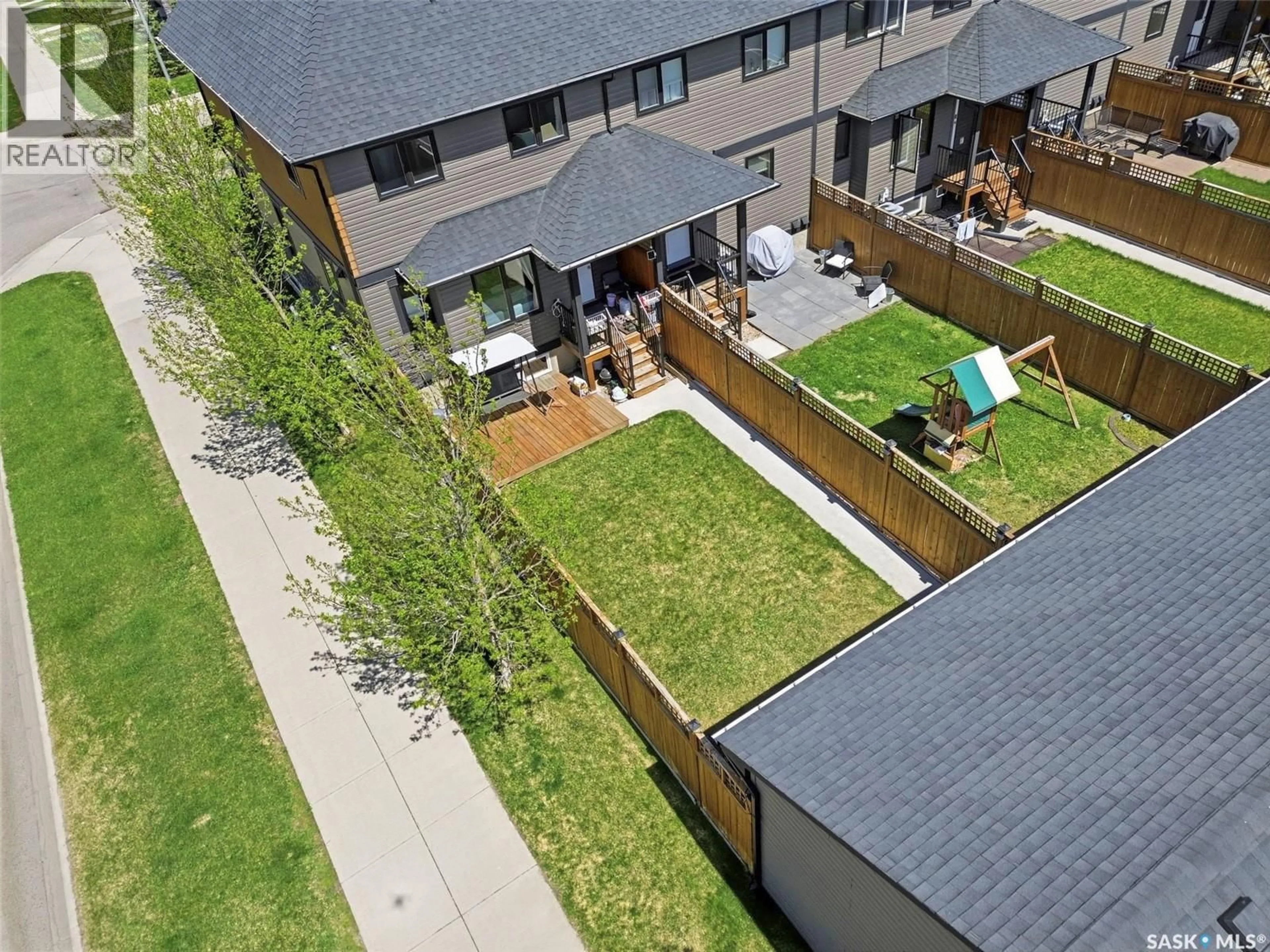 A pic from outside/outdoor area/front of a property/back of a property/a pic from drone, street for 201 RAJPUT WAY, Saskatoon Saskatchewan S7P0A5