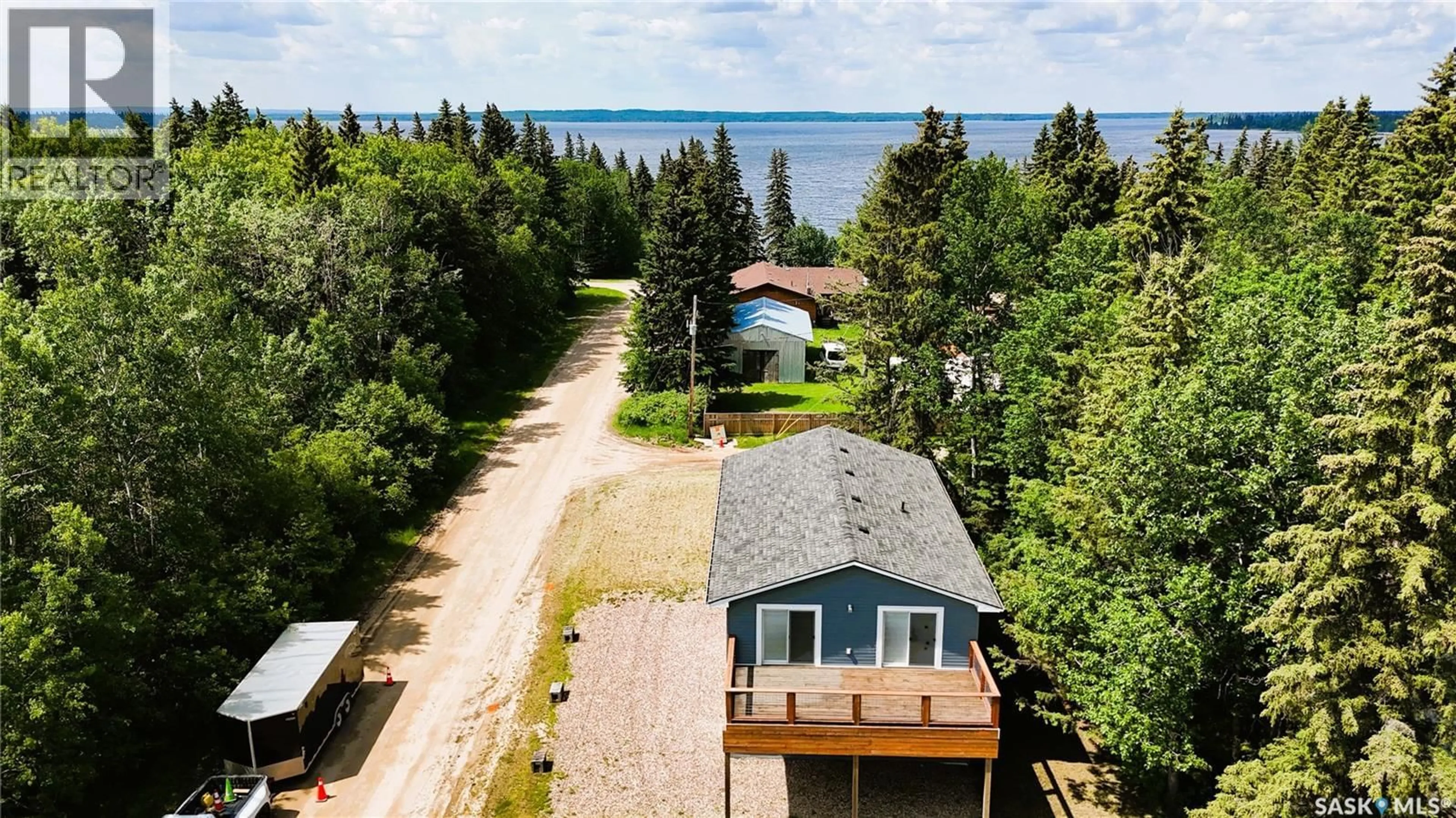 A pic from outside/outdoor area/front of a property/back of a property/a pic from drone, water/lake/river/ocean view for 720 RAILWAY STREET, Chitek Lake Saskatchewan S0J0L0