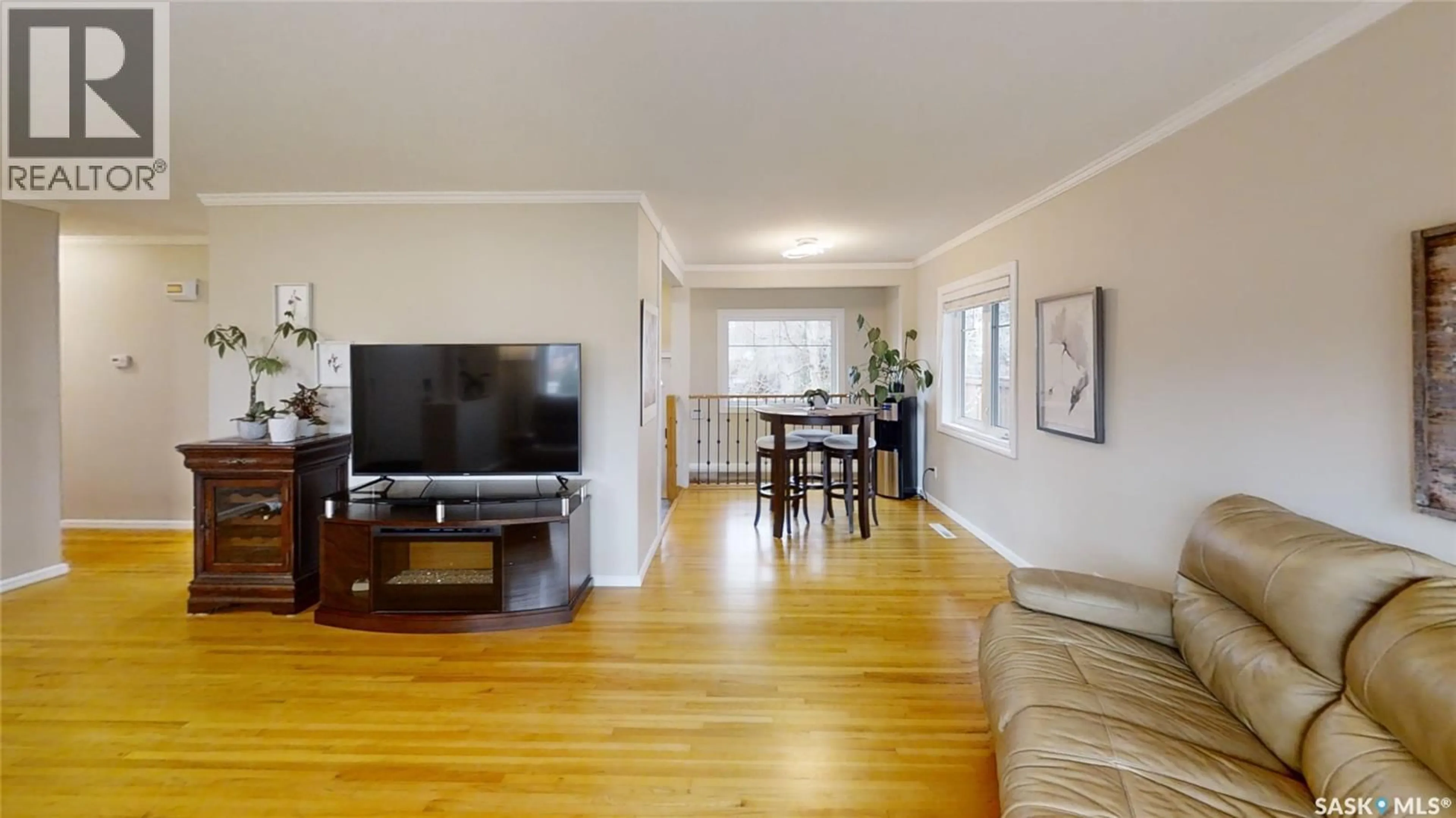 Living room with furniture, wood/laminate floor for S - 1705 WIGGINS AVENUE, Saskatoon Saskatchewan S7H2K1