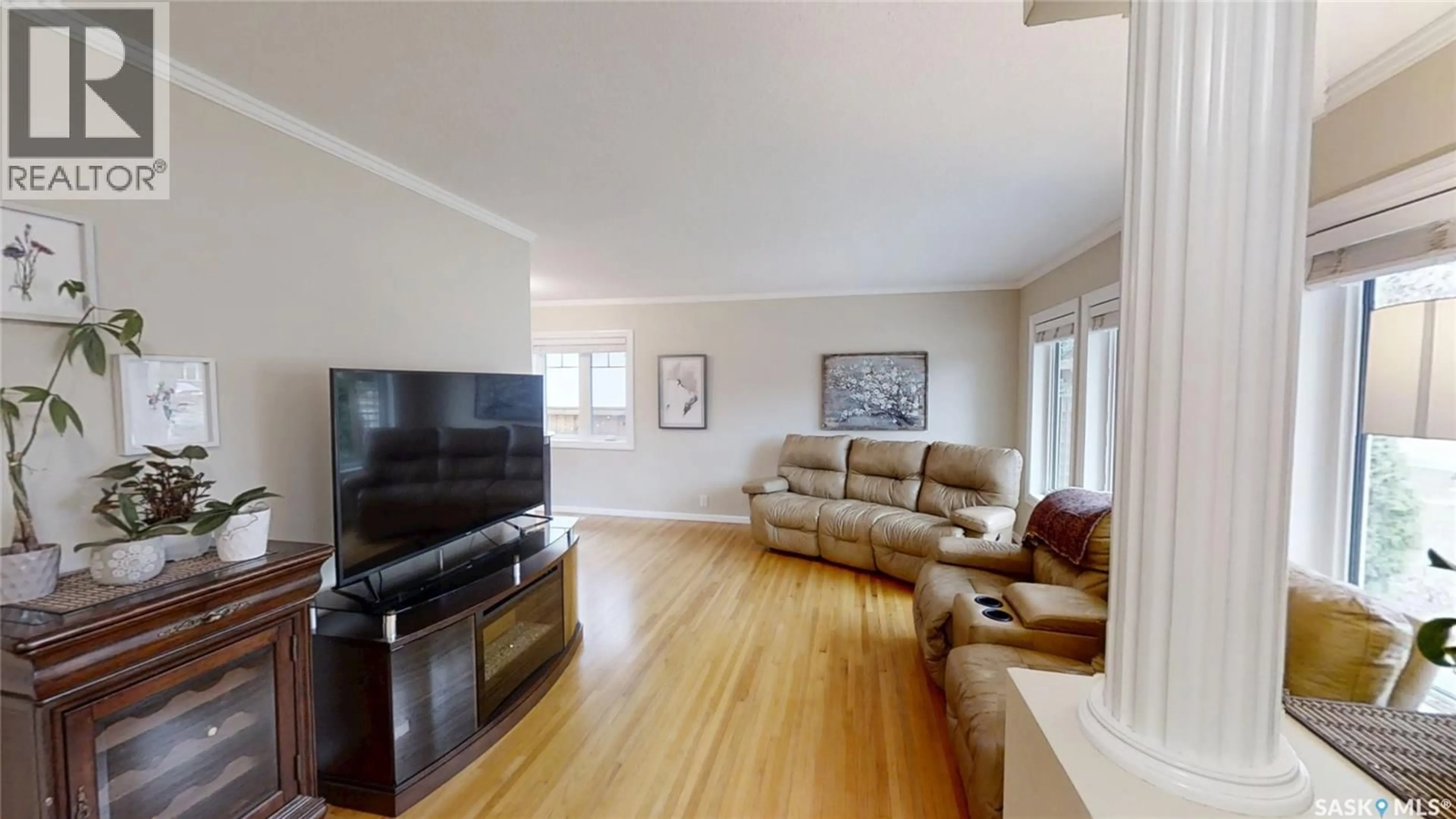 Living room with furniture, wood/laminate floor for S - 1705 WIGGINS AVENUE, Saskatoon Saskatchewan S7H2K1