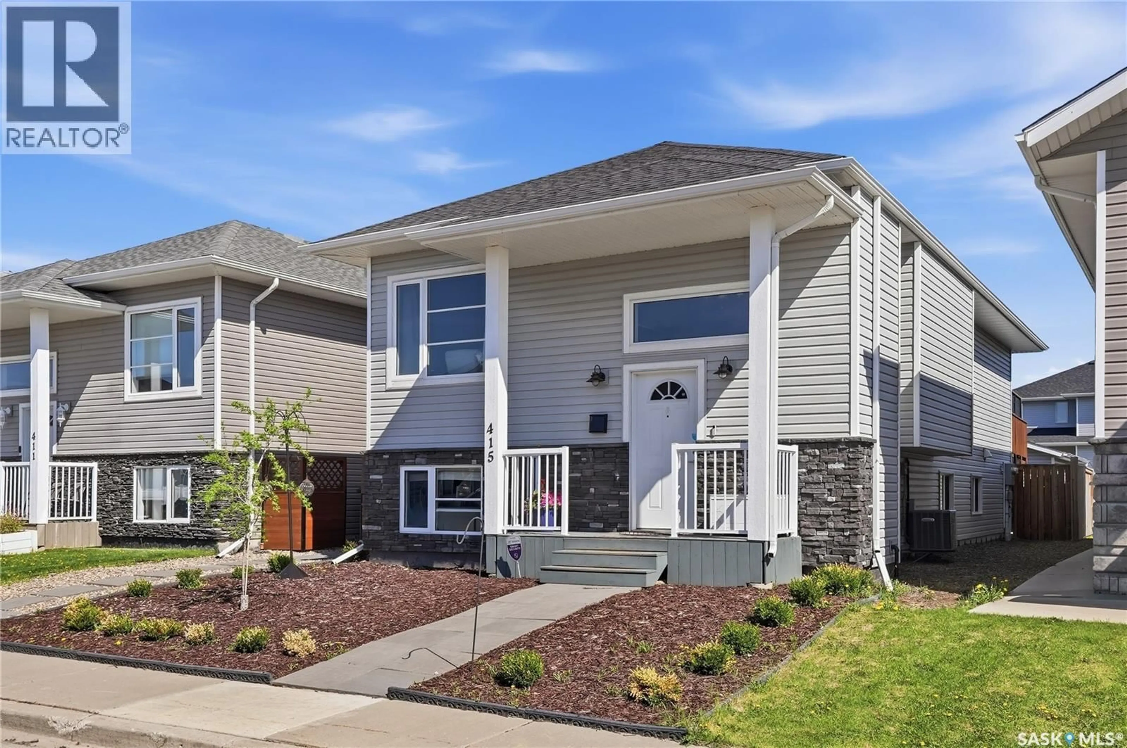 Home with vinyl exterior material, street for 415 BOYKOWICH STREET, Saskatoon Saskatchewan S7W0B8