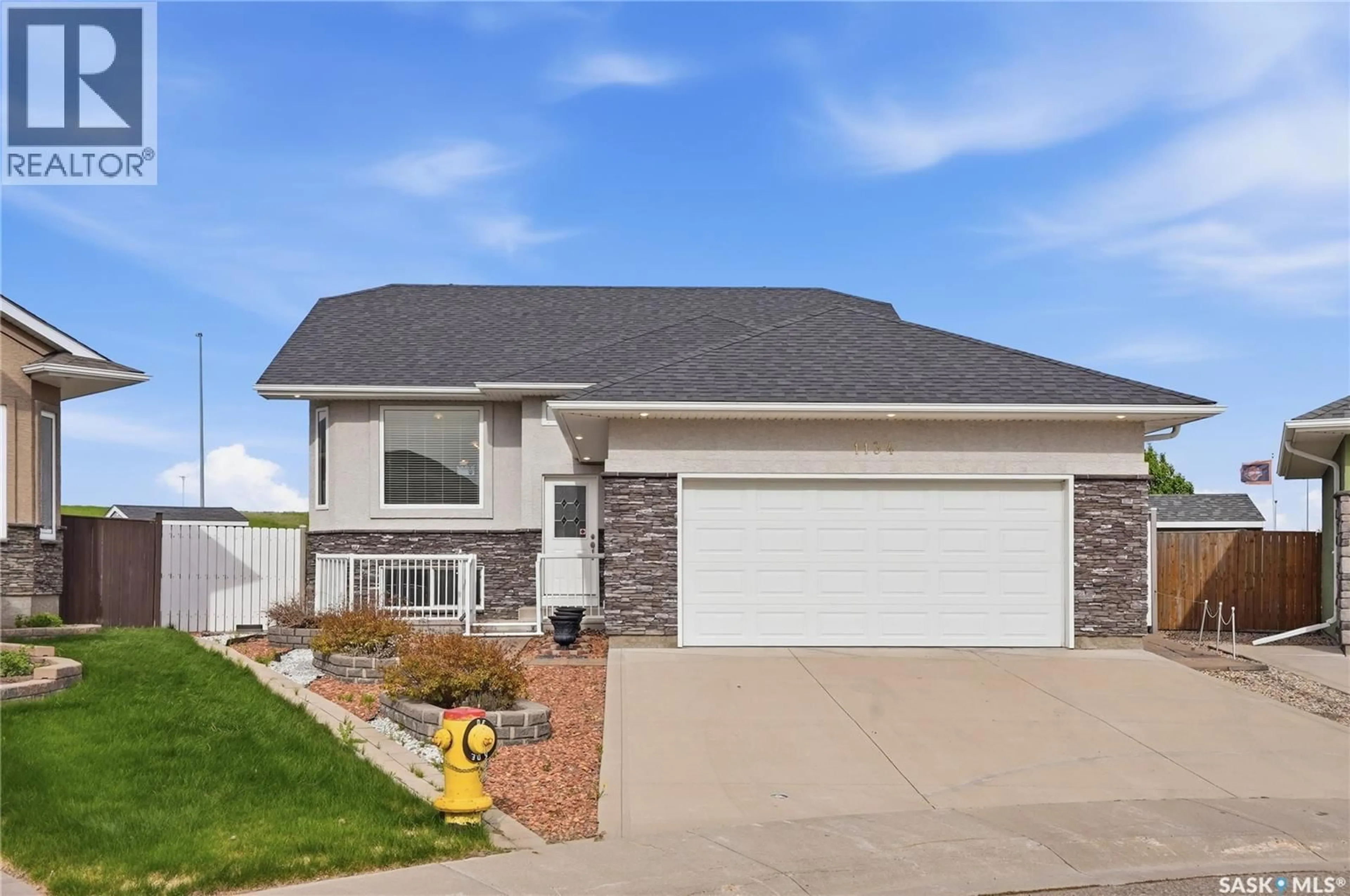 Home with vinyl exterior material, street for 1134 REMPEL PLACE, Saskatoon Saskatchewan S7T0M2