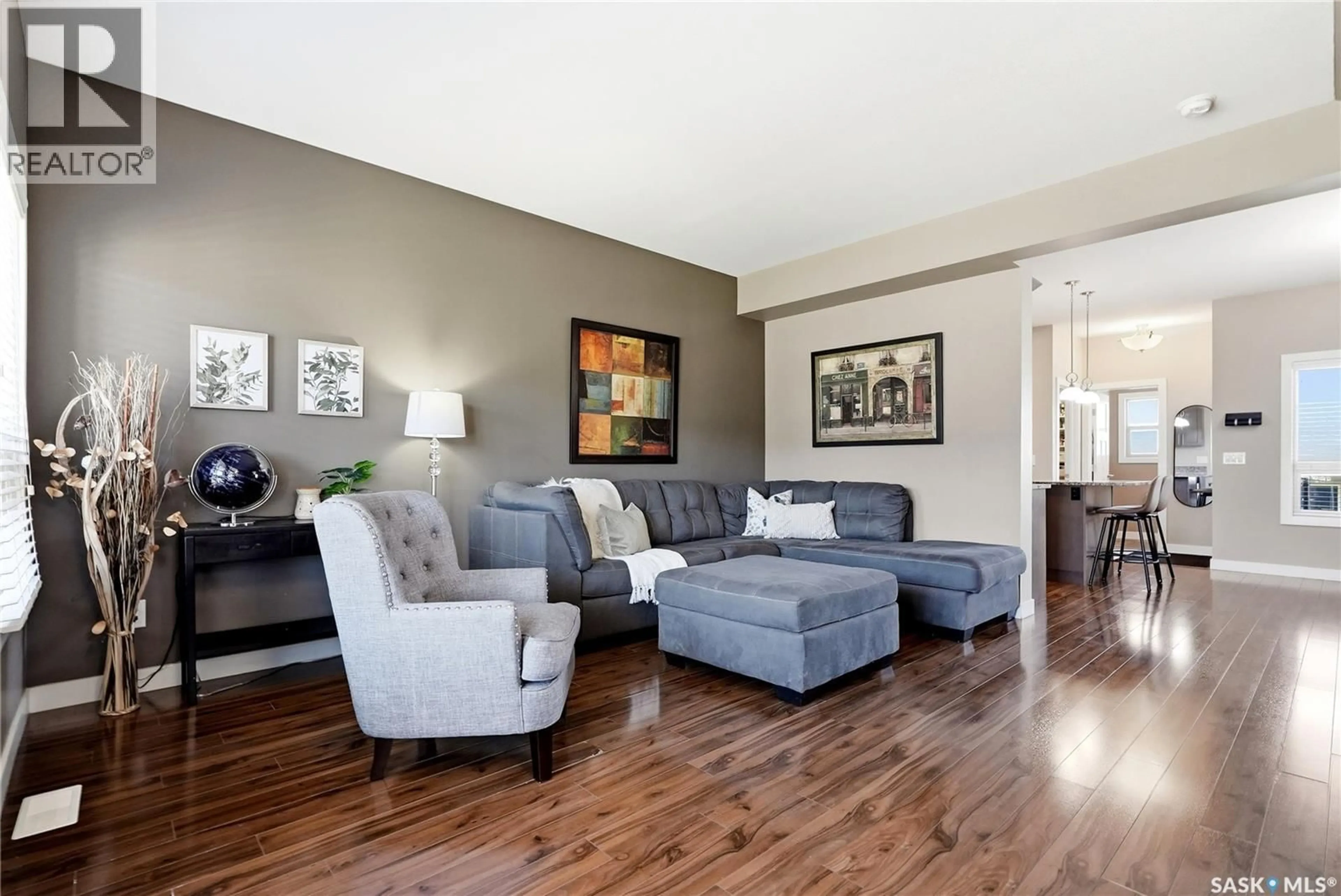 Living room with furniture, wood/laminate floor for N - 142 ROSEWOOD GATE, Saskatoon Saskatchewan S7V0K9
