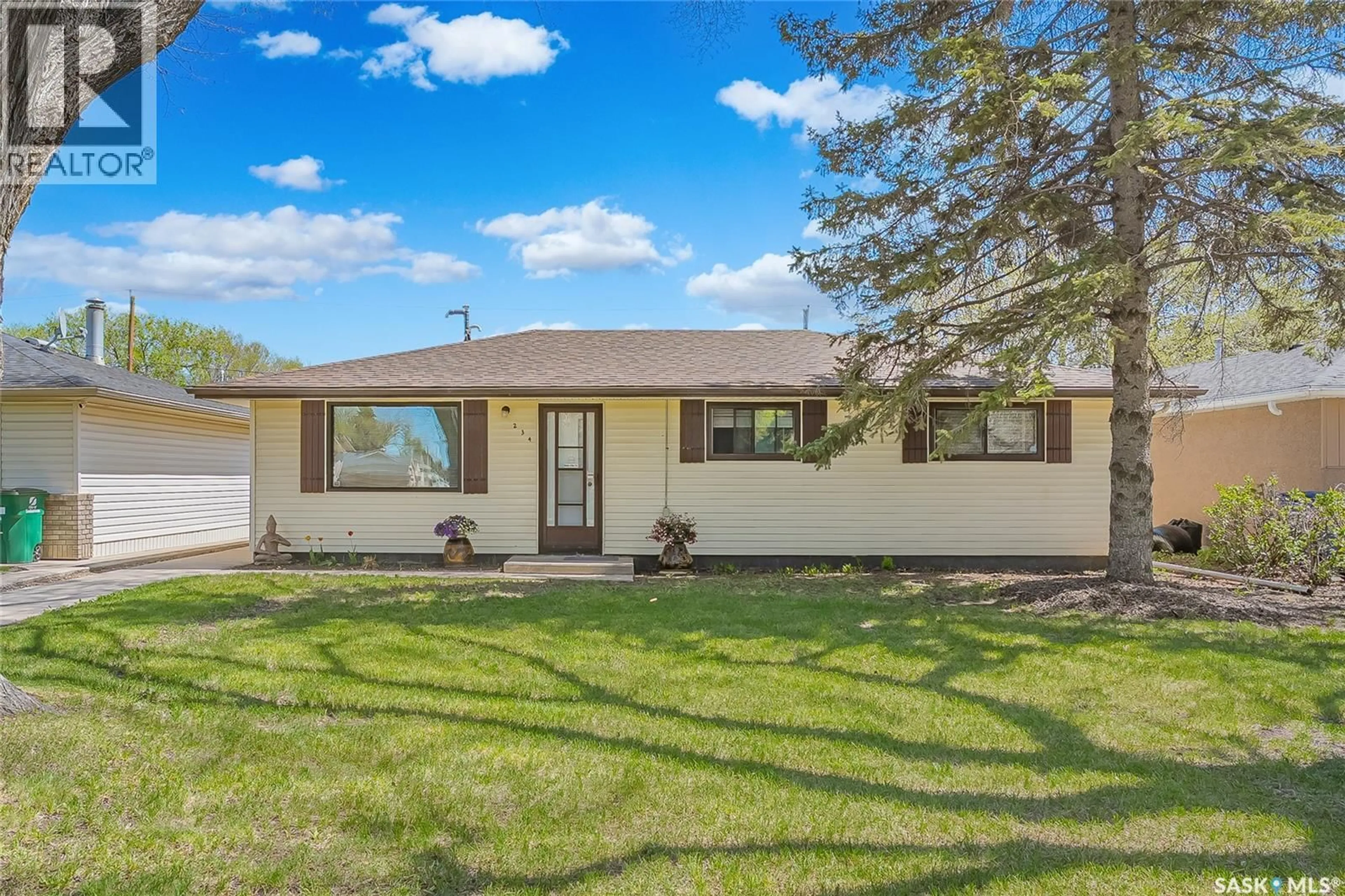 Home with vinyl exterior material, street for 234 WINNIPEG AVENUE, Saskatoon Saskatchewan S7L3P4