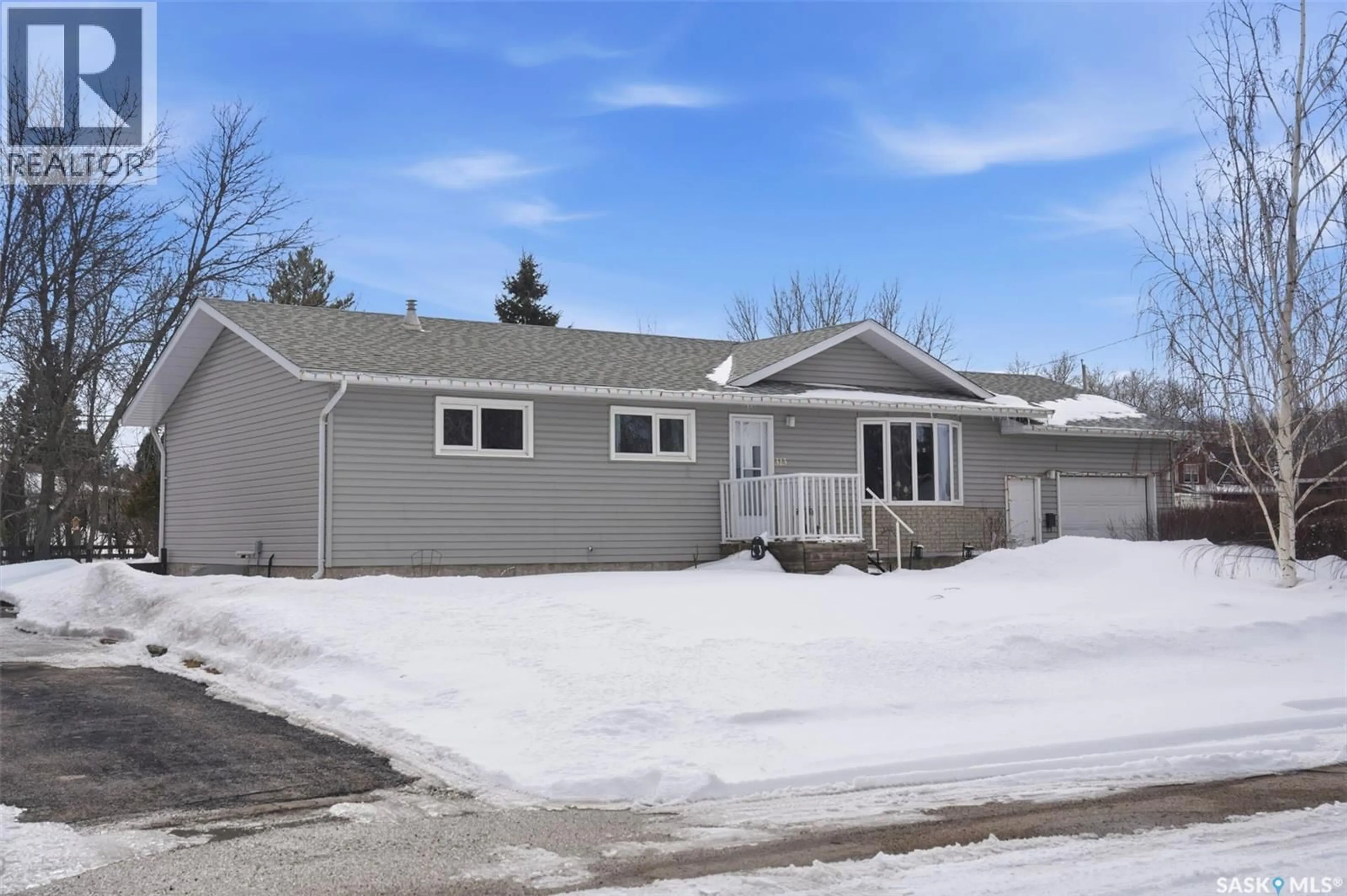 Home with vinyl exterior material, street for 313 7TH AVENUE, Watrous Saskatchewan S0K4T0