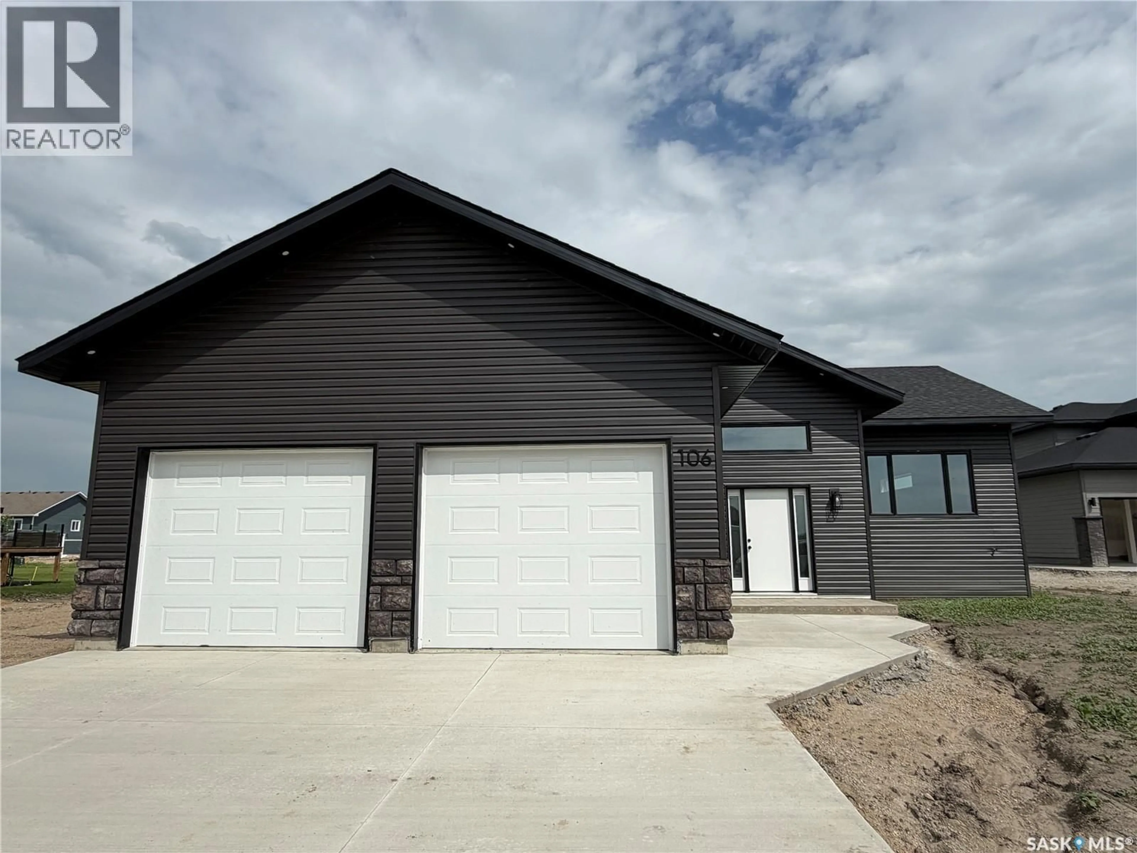 Home with vinyl exterior material, street for 106 LAKEWOOD DRIVE, Humboldt Saskatchewan S0K2A0