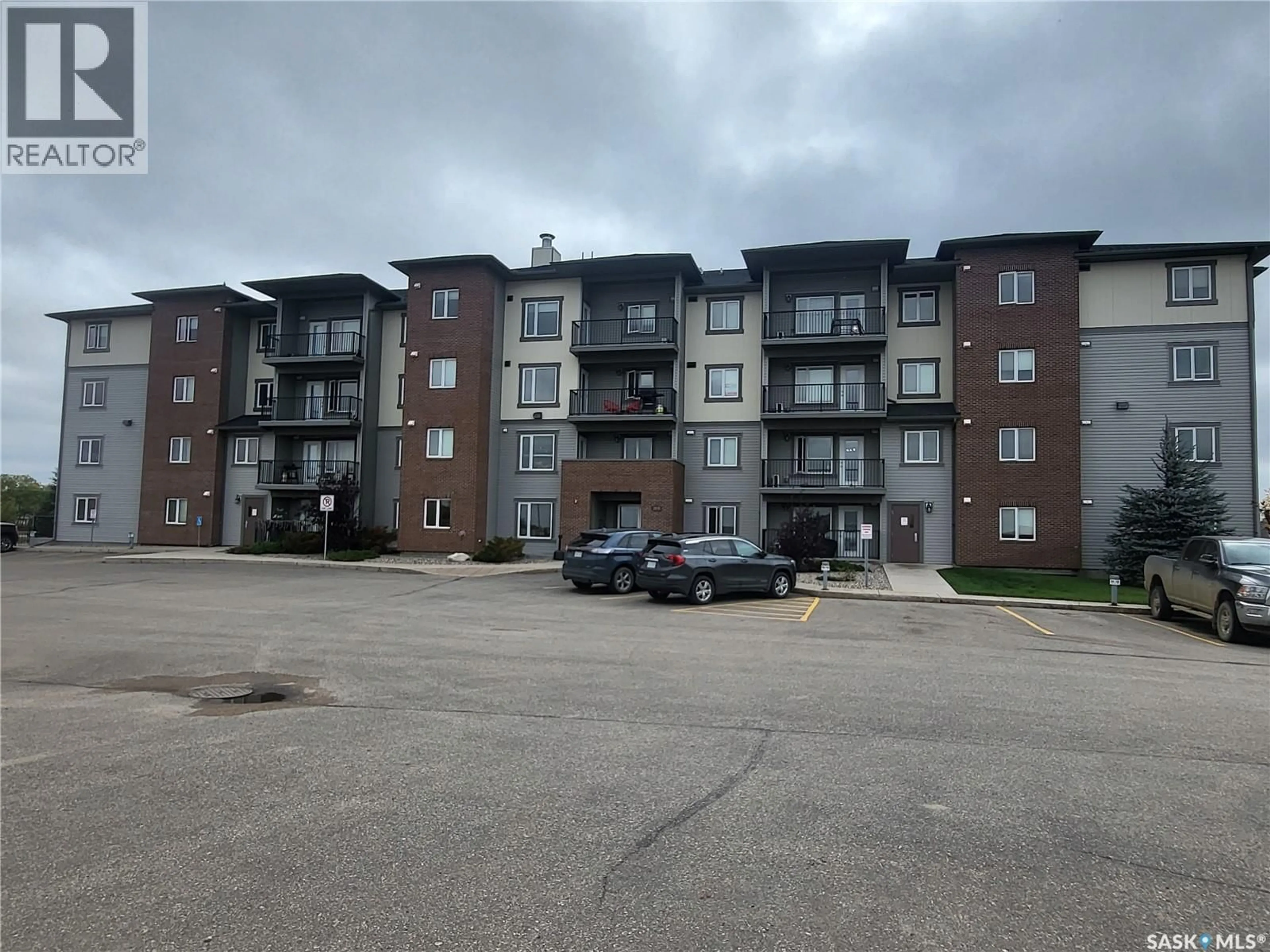 A pic from outside/outdoor area/front of a property/back of a property/a pic from drone, building for 403 - 2141 LARTER ROAD, Estevan Saskatchewan S4A2Y5