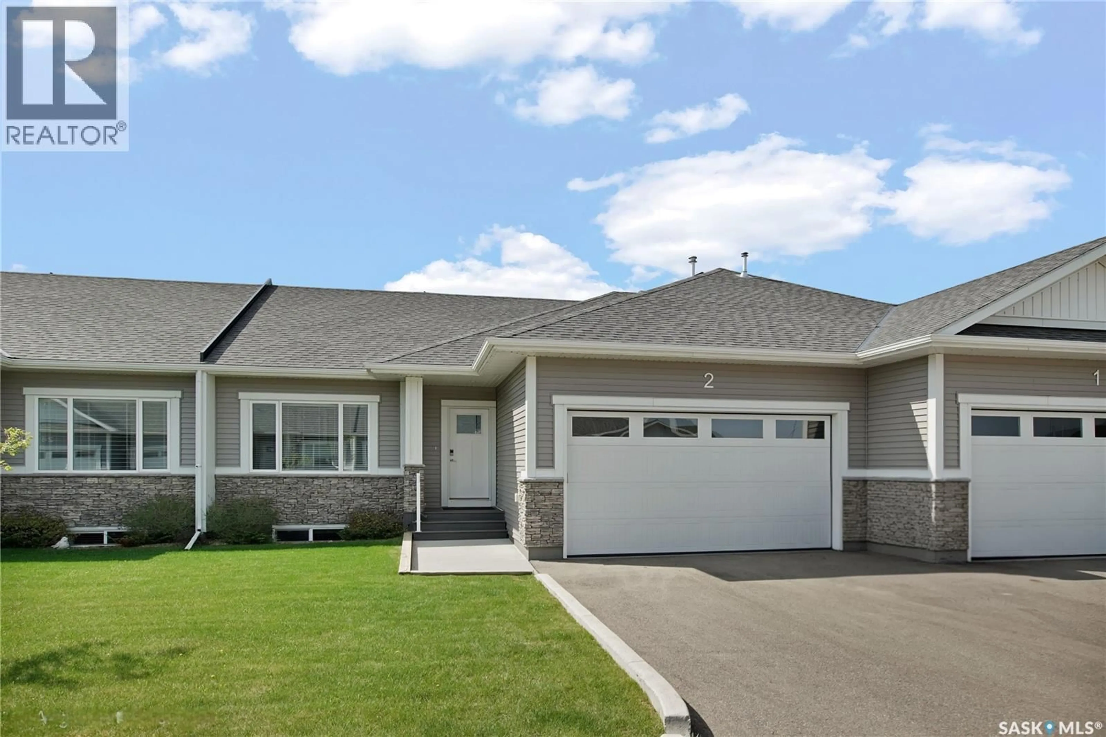 Home with vinyl exterior material, street for 2 437 PALMER CRESCENT, Warman Saskatchewan S0K4S1