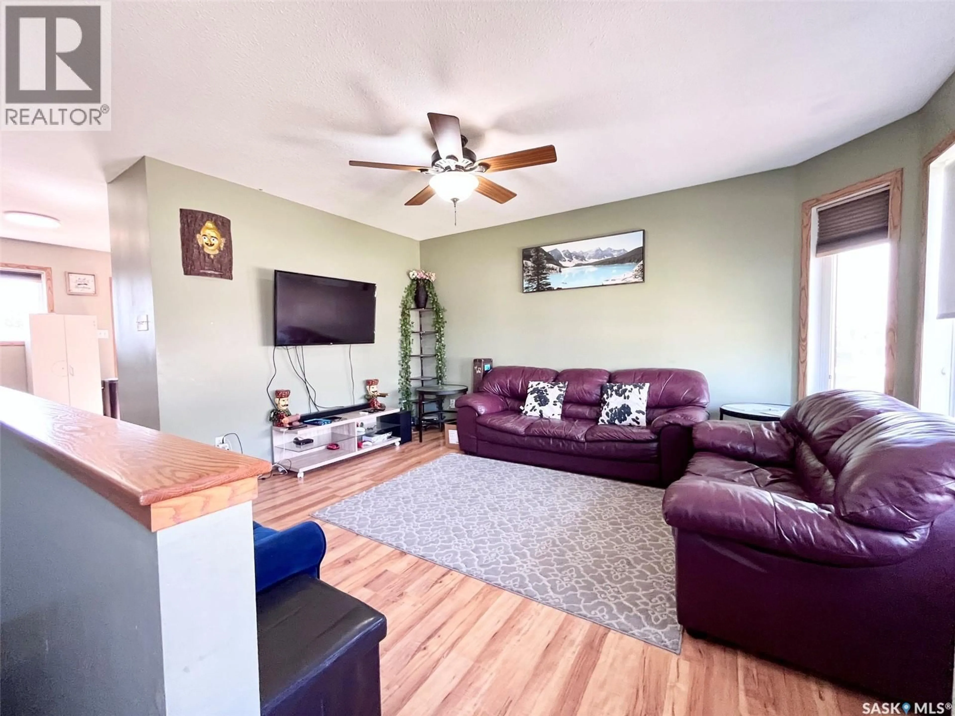 Living room with furniture, wood/laminate floor for 3150 3RD AVENUE, Prince Albert Saskatchewan S6V8E7