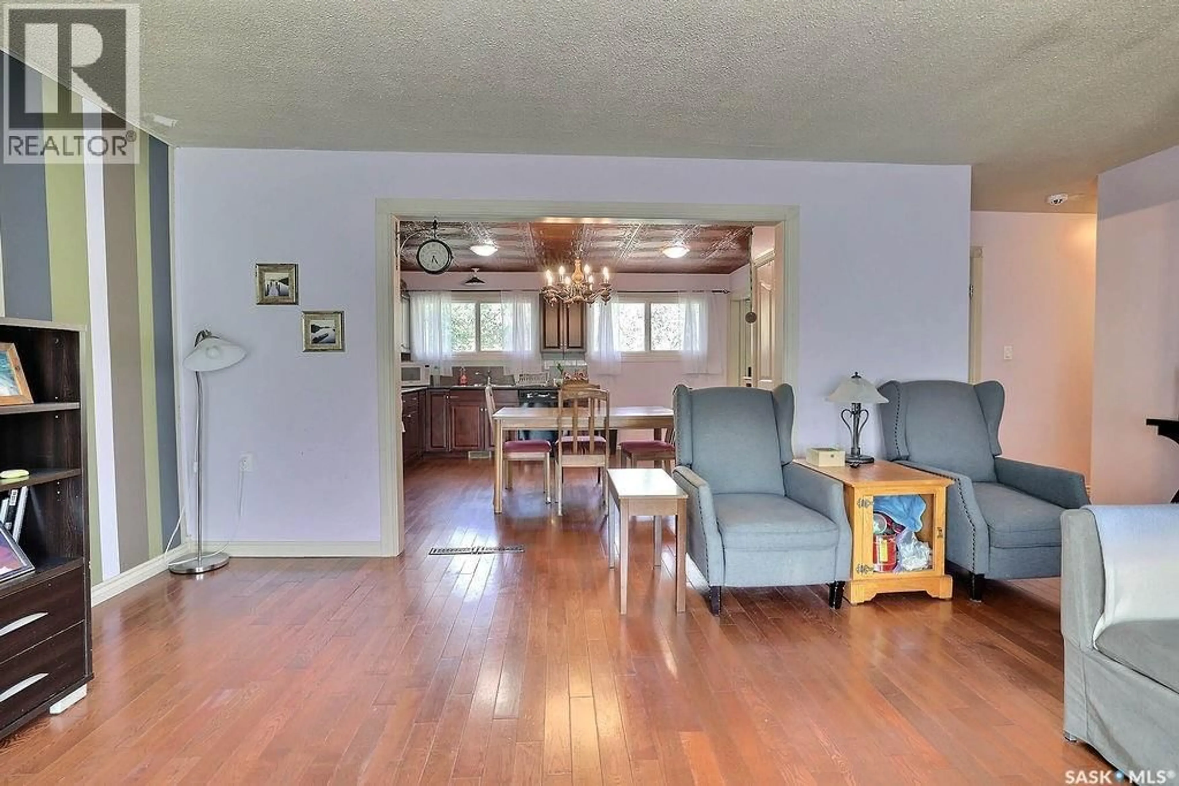 Living room with furniture, wood/laminate floor for 170 ELGIN CRESCENT, Lumsden Saskatchewan S0G3C0