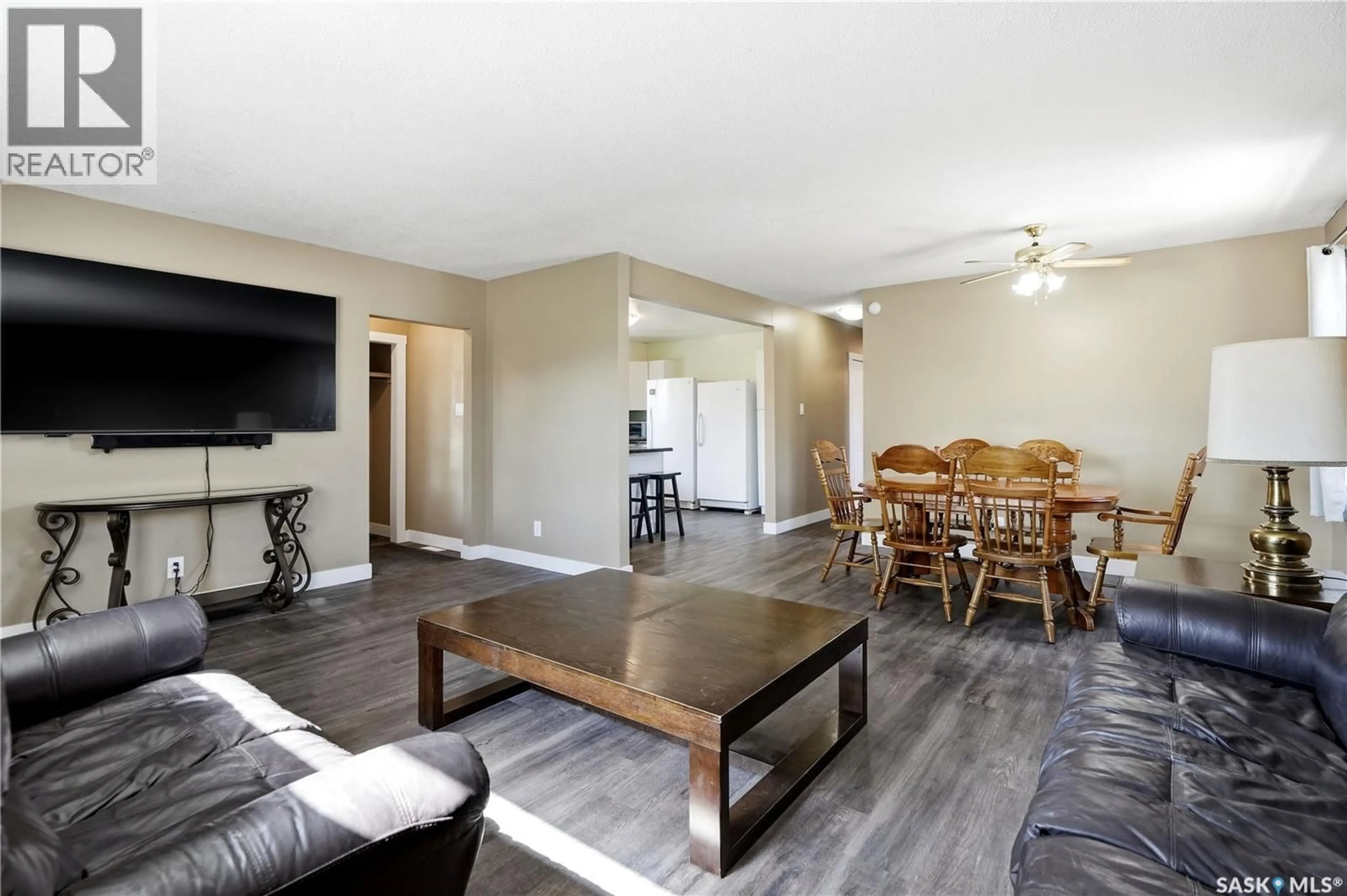 Living room with furniture, wood/laminate floor for 1360 LACON STREET, Regina Saskatchewan S4N1Y9