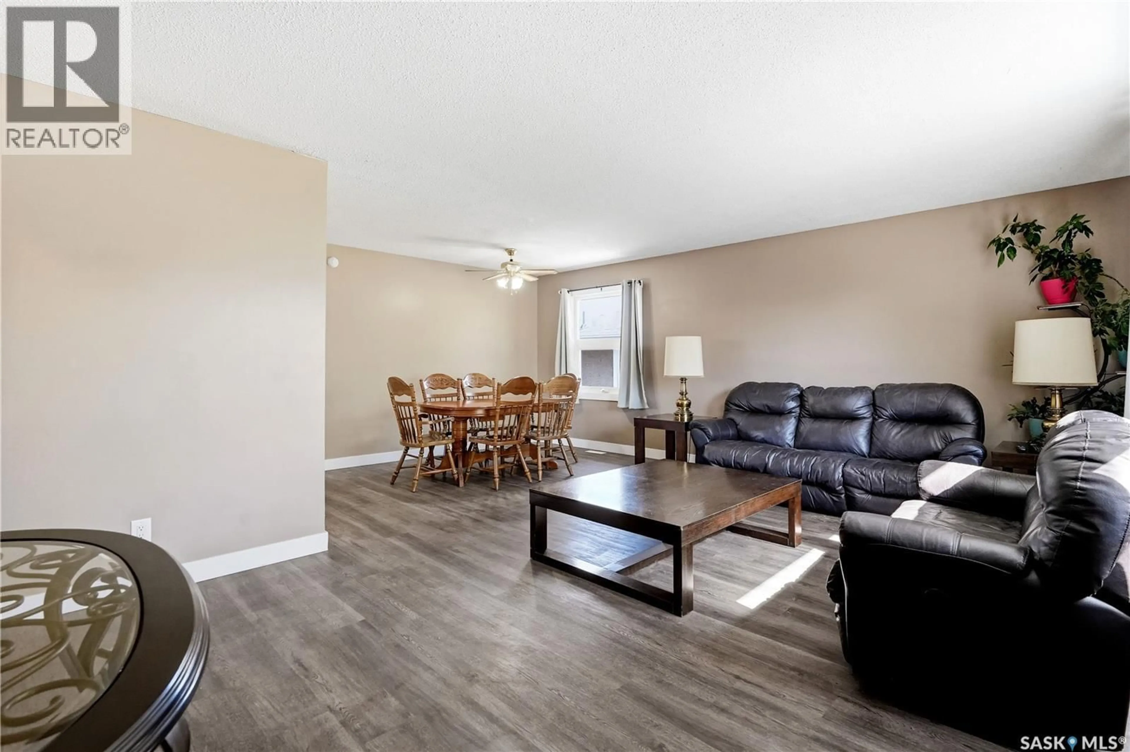 Living room with furniture, wood/laminate floor for 1360 LACON STREET, Regina Saskatchewan S4N1Y9