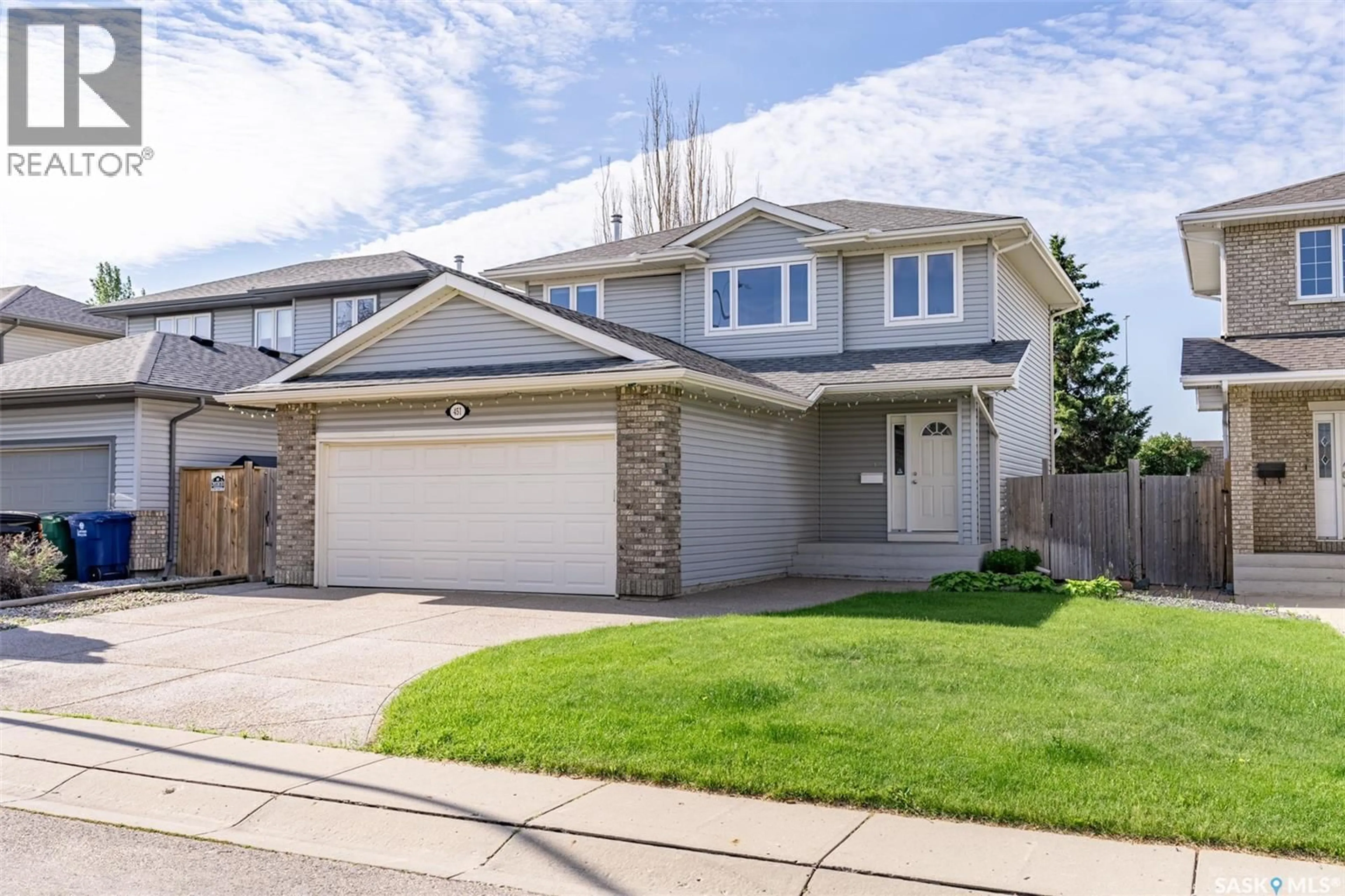 Home with vinyl exterior material, street for 451 BUCKWOLD COVE, Saskatoon Saskatchewan S7N4W1