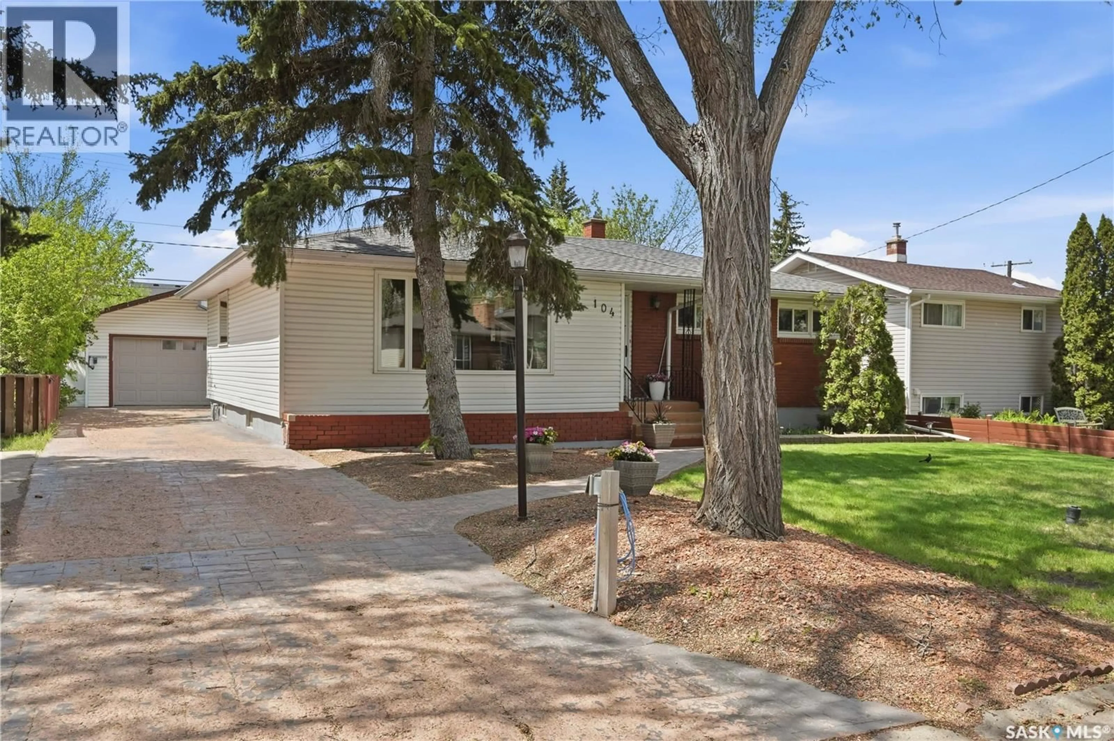 Home with brick exterior material, street for 104 MARSH CRESCENT, Regina Saskatchewan S4S6B4