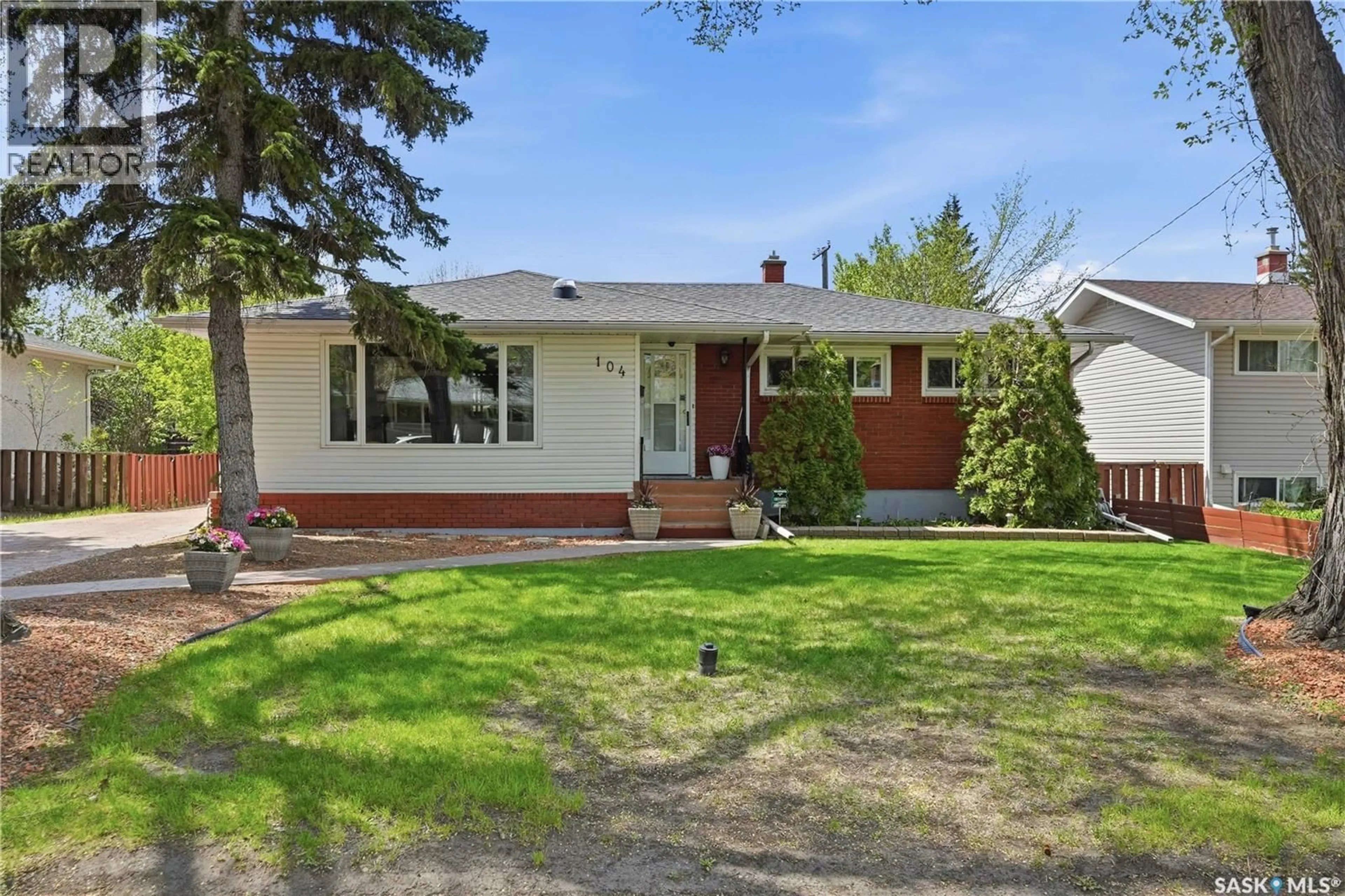 Home with brick exterior material, street for 104 MARSH CRESCENT, Regina Saskatchewan S4S6B4