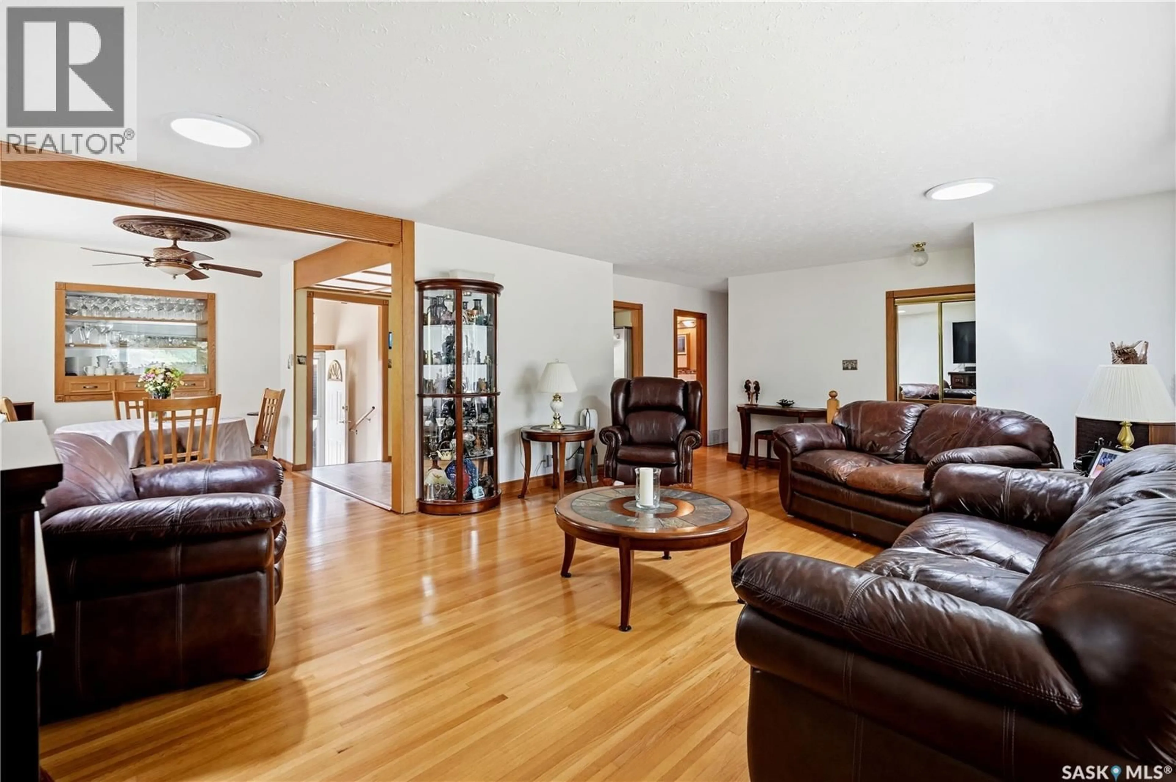 Living room with furniture, wood/laminate floor for 104 MARSH CRESCENT, Regina Saskatchewan S4S6B4