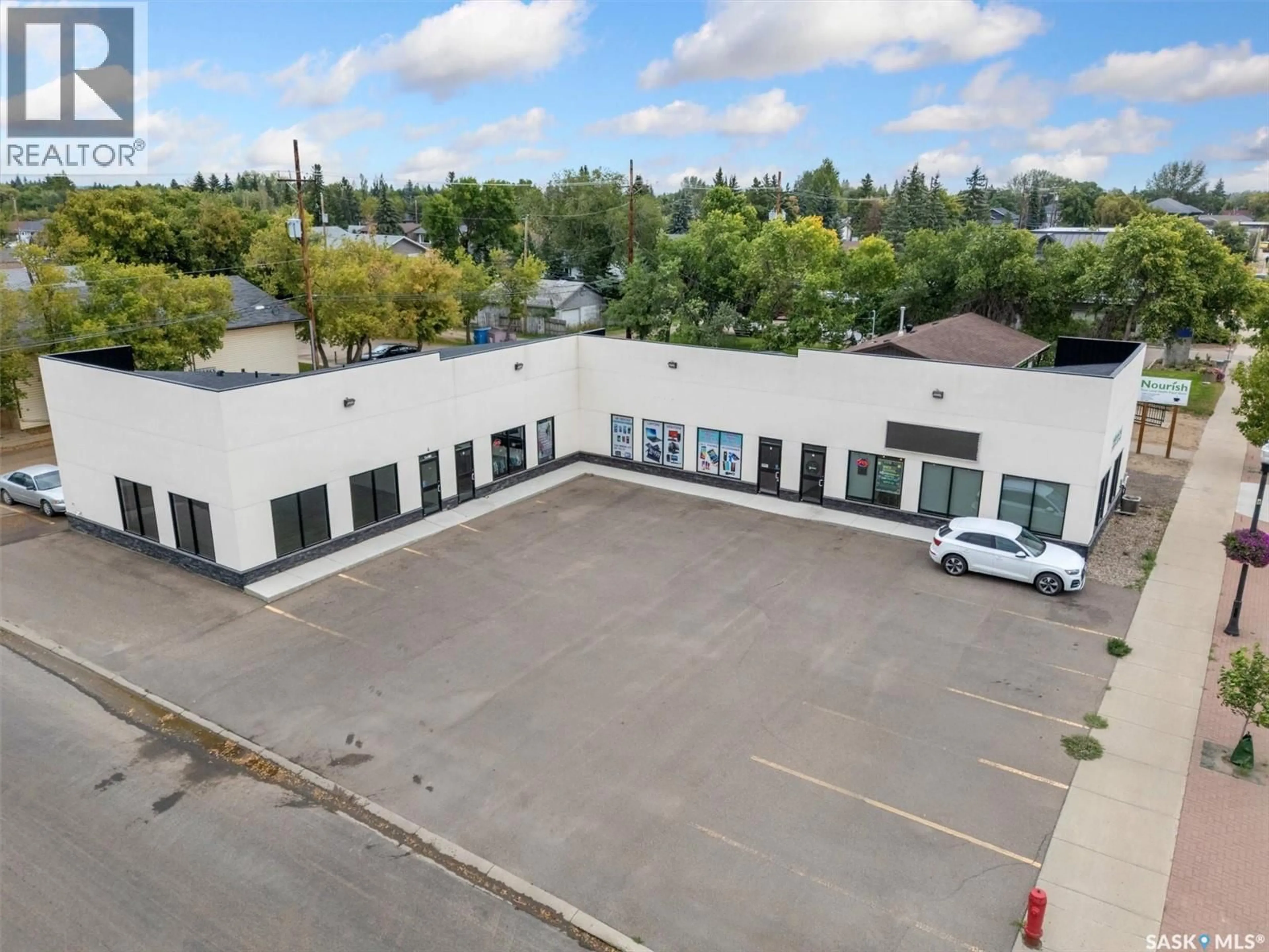 A pic from outside/outdoor area/front of a property/back of a property/a pic from drone, building for 3 212 CENTRAL STREET, Warman Saskatchewan S0K0A1