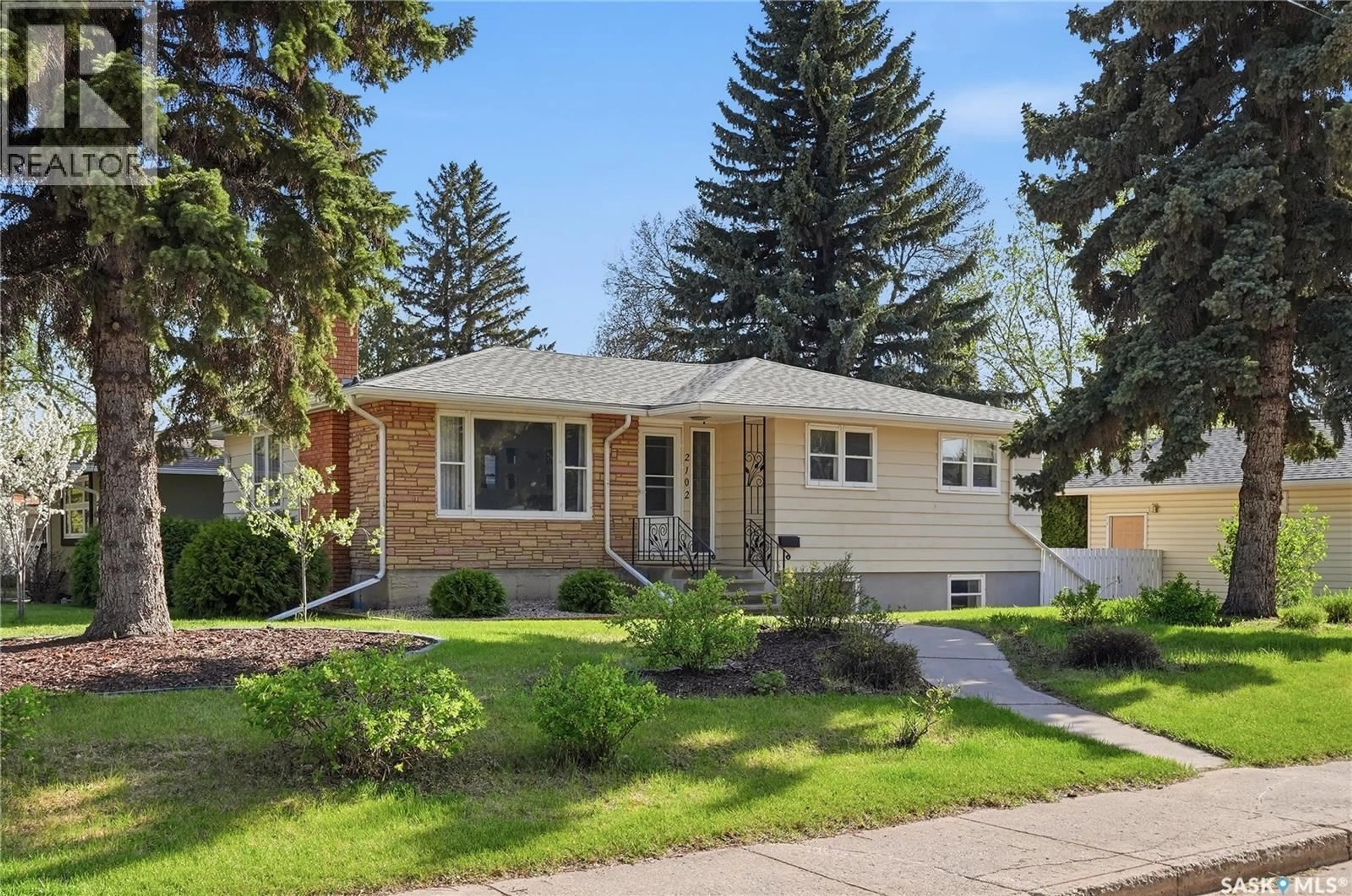 Home with vinyl exterior material, street for 2102 CUMBERLAND AVENUE, Saskatoon Saskatchewan S7J1Z3