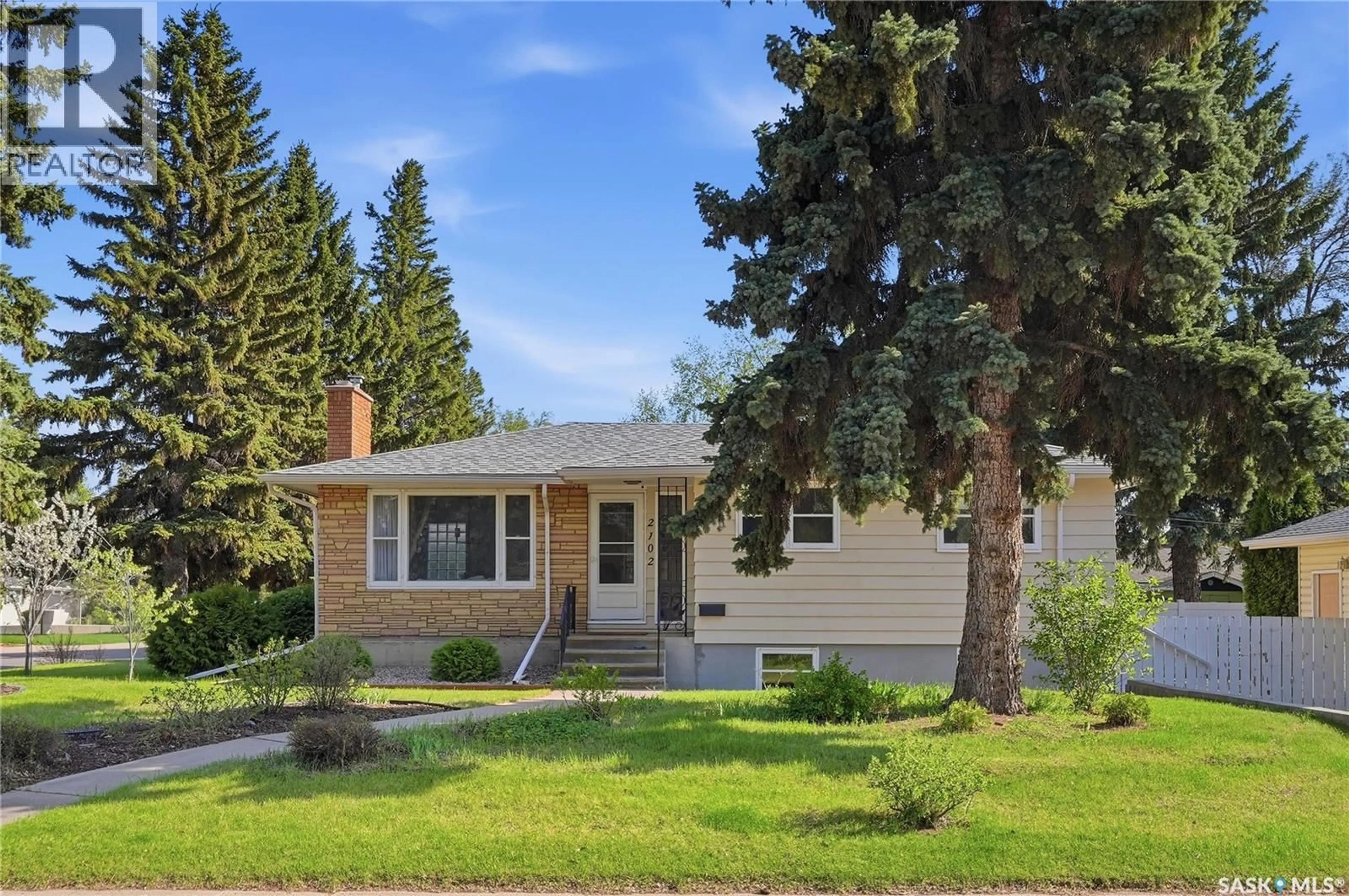 Home with vinyl exterior material, street for 2102 CUMBERLAND AVENUE, Saskatoon Saskatchewan S7J1Z3