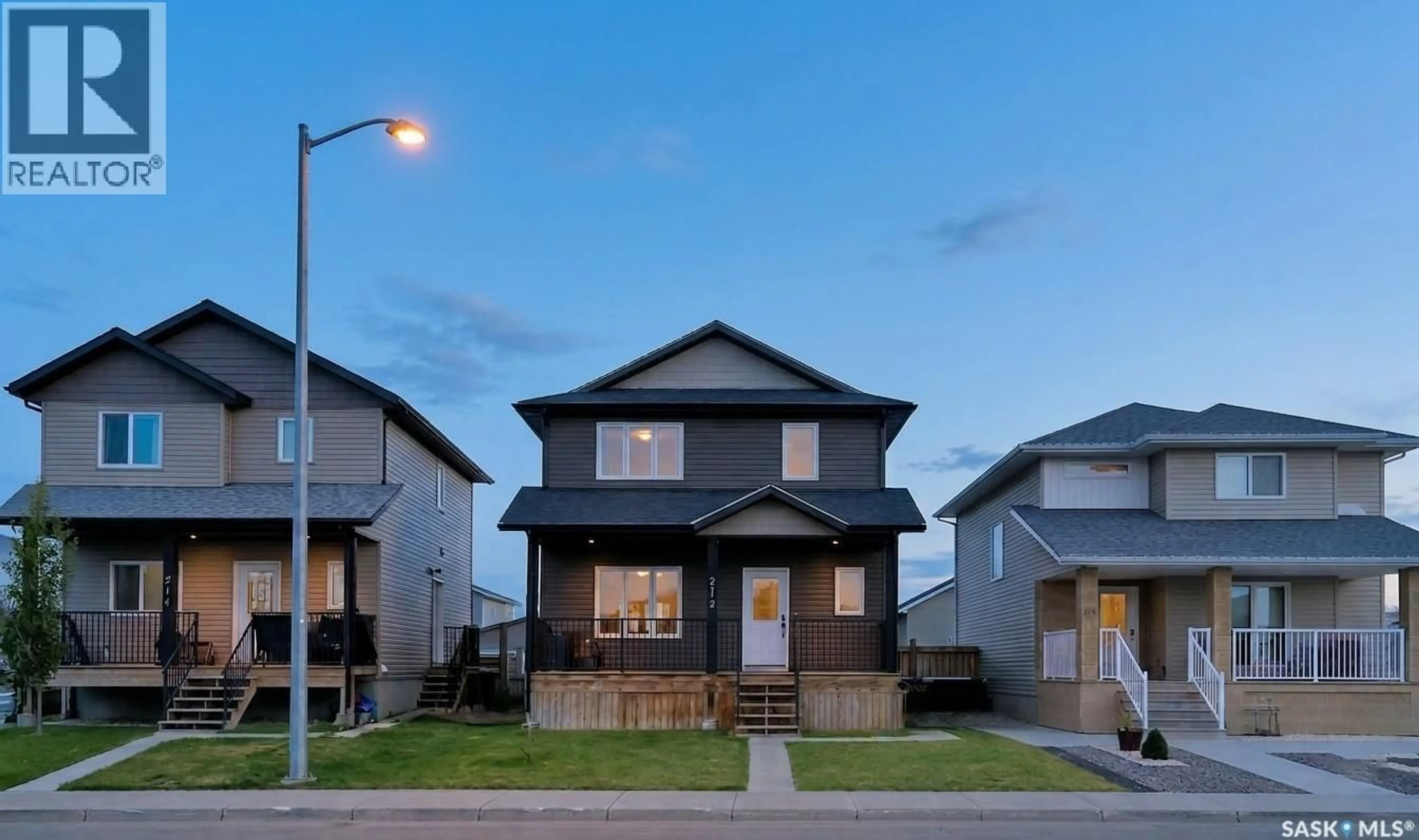 Home with vinyl exterior material, street for 212 MARTENS LANE, Warman Saskatchewan S0K4S3
