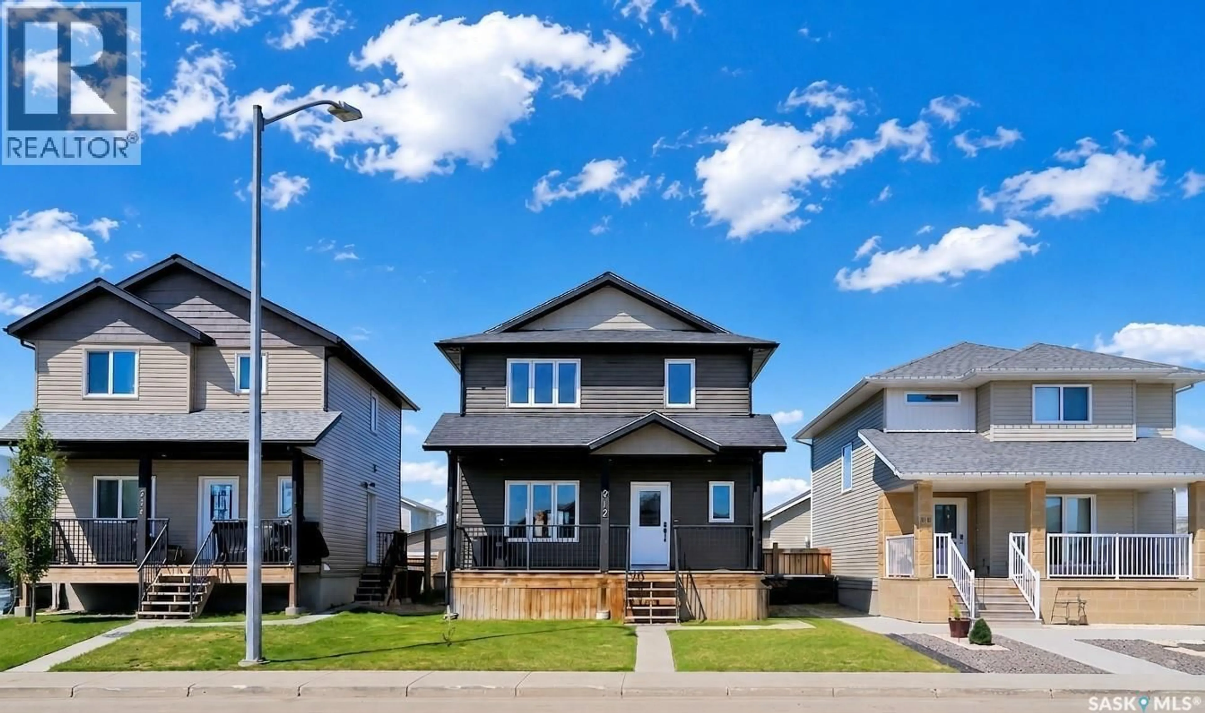 Home with vinyl exterior material, street for 212 MARTENS LANE, Warman Saskatchewan S0K4S3
