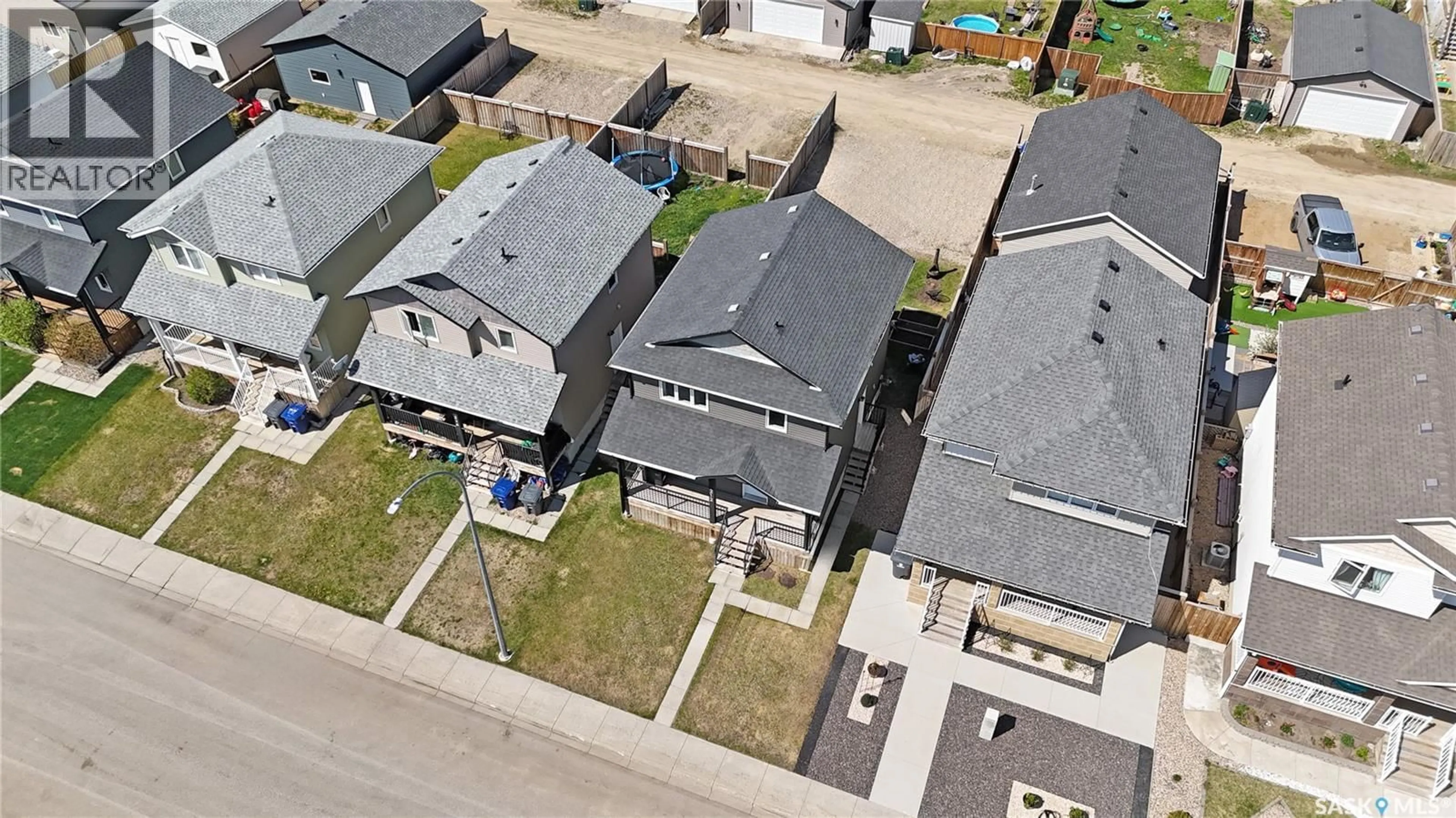 A pic from outside/outdoor area/front of a property/back of a property/a pic from drone, street for 212 MARTENS LANE, Warman Saskatchewan S0K4S3