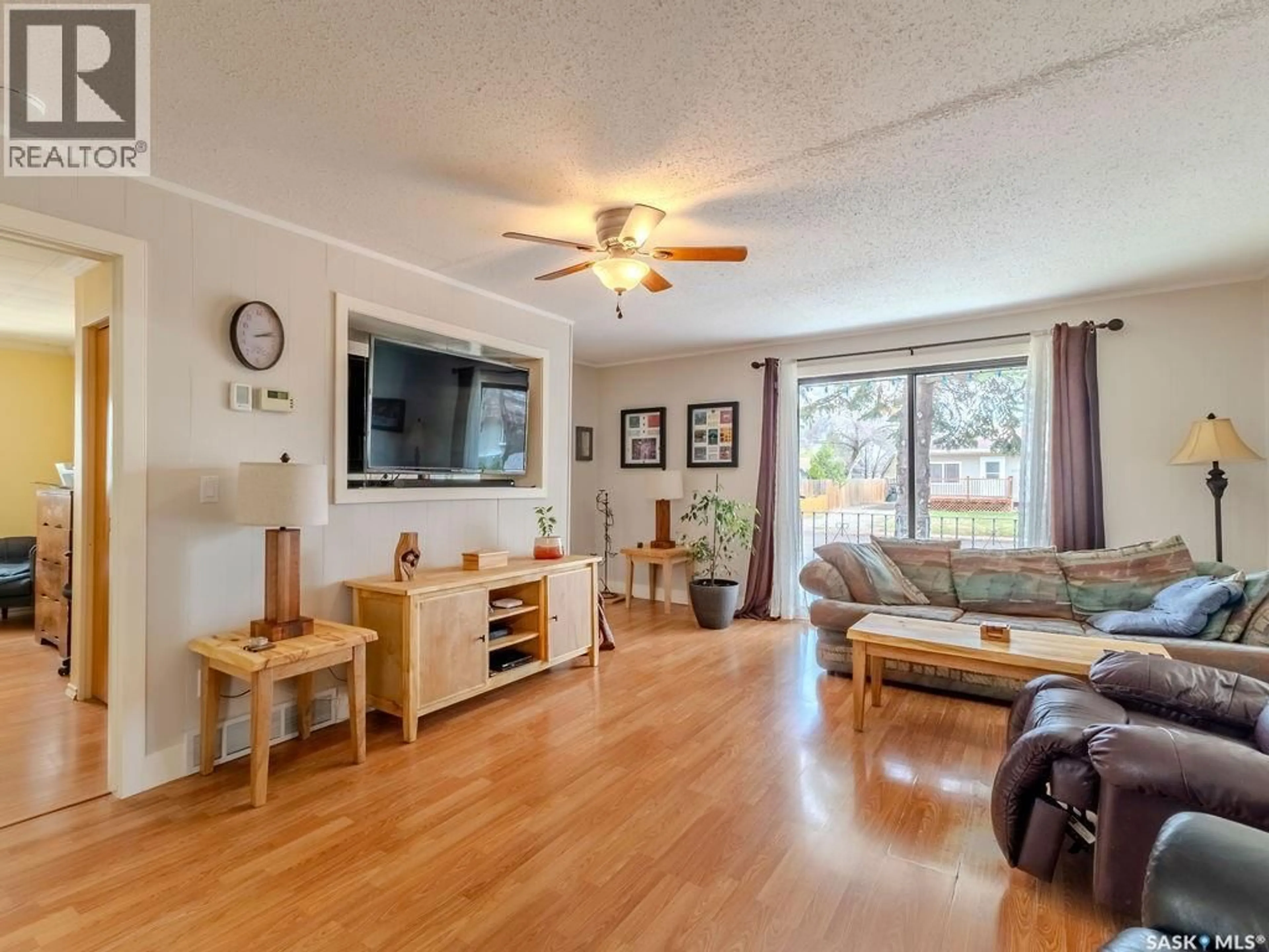 Living room with furniture, wood/laminate floor for 316 1ST STREET, Delisle Saskatchewan S0L0P0