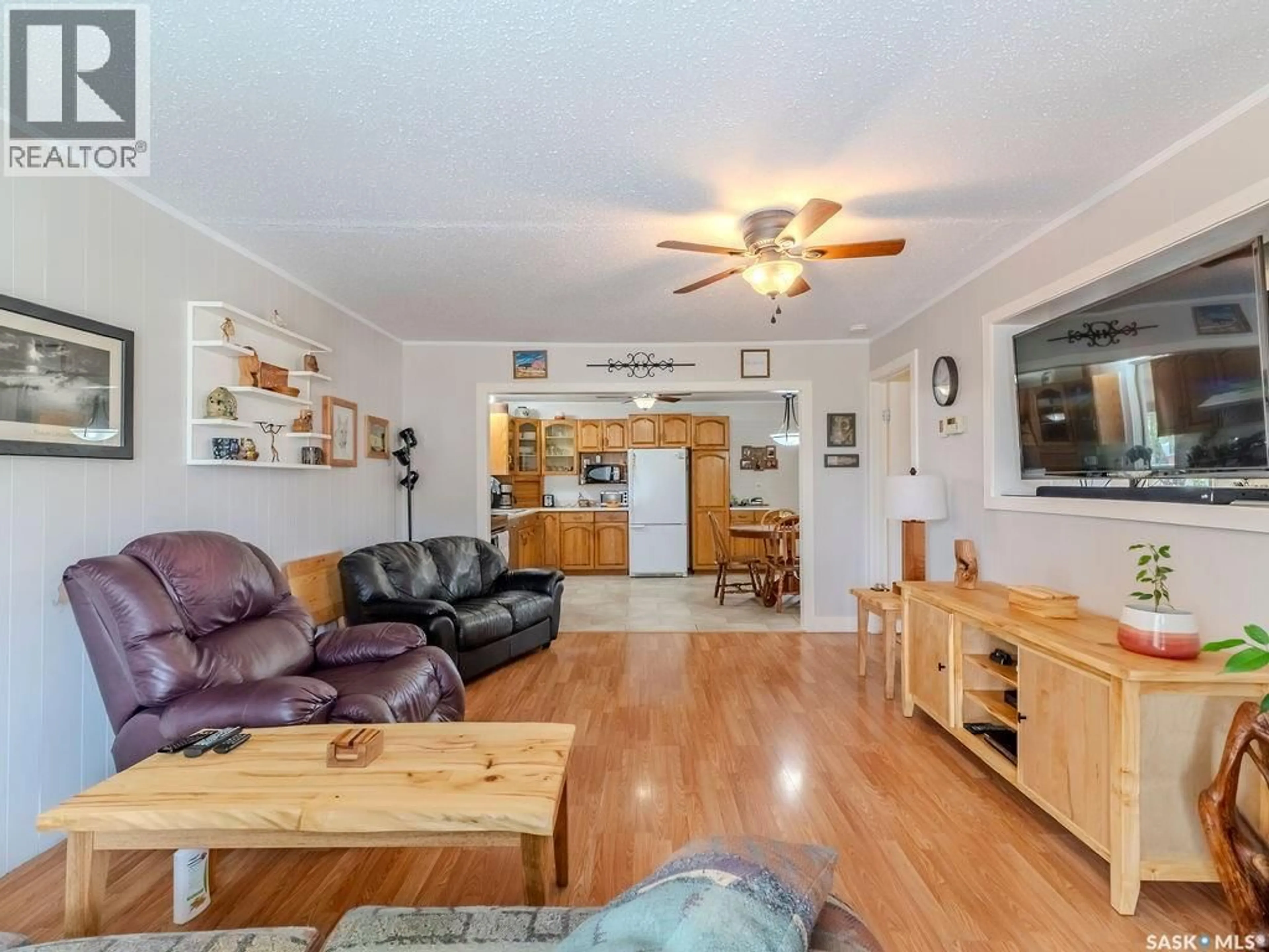 Living room with furniture, wood/laminate floor for 316 1ST STREET, Delisle Saskatchewan S0L0P0