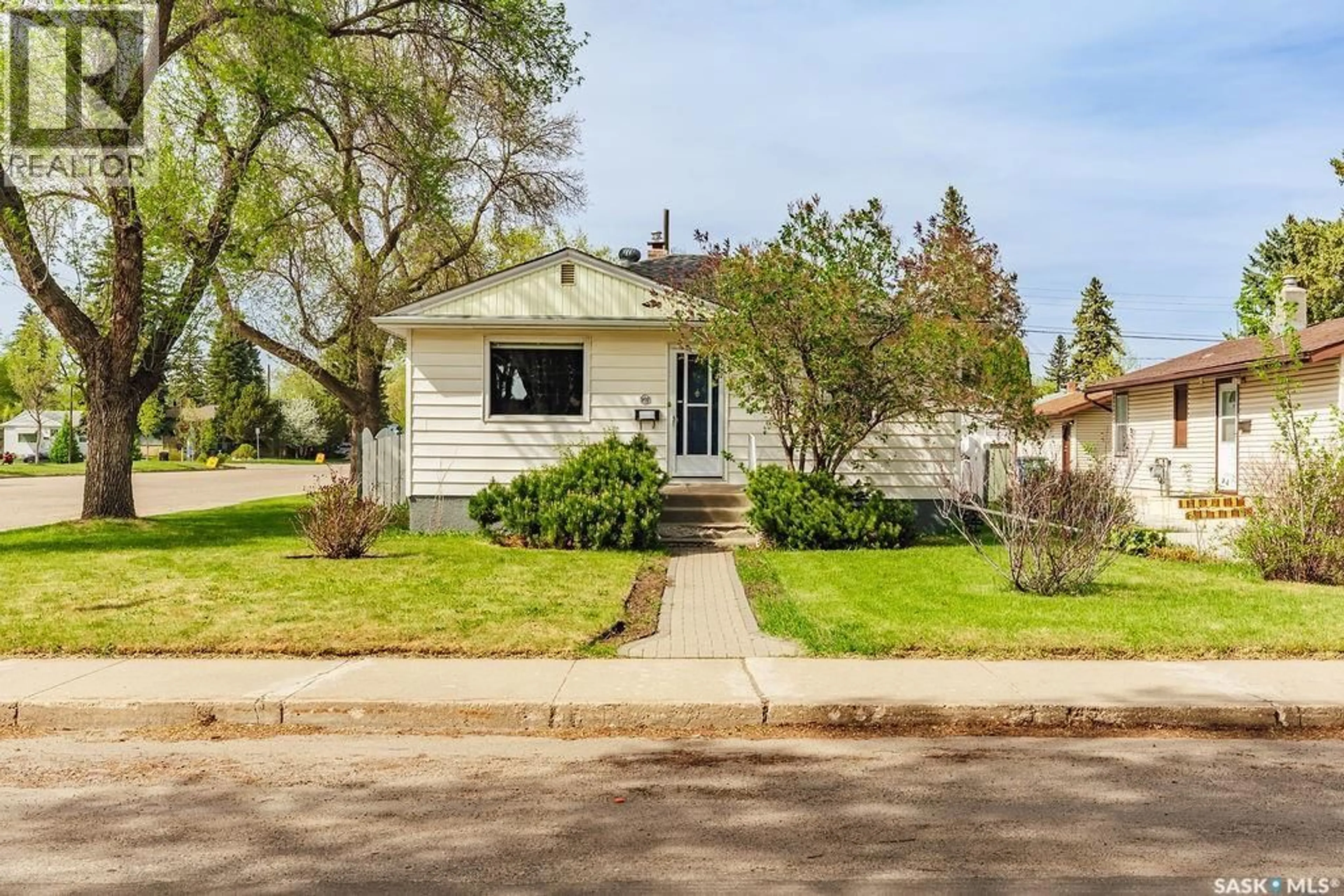 Home with vinyl exterior material, street for 901 1ST STREET, Saskatoon Saskatchewan S7H1T2