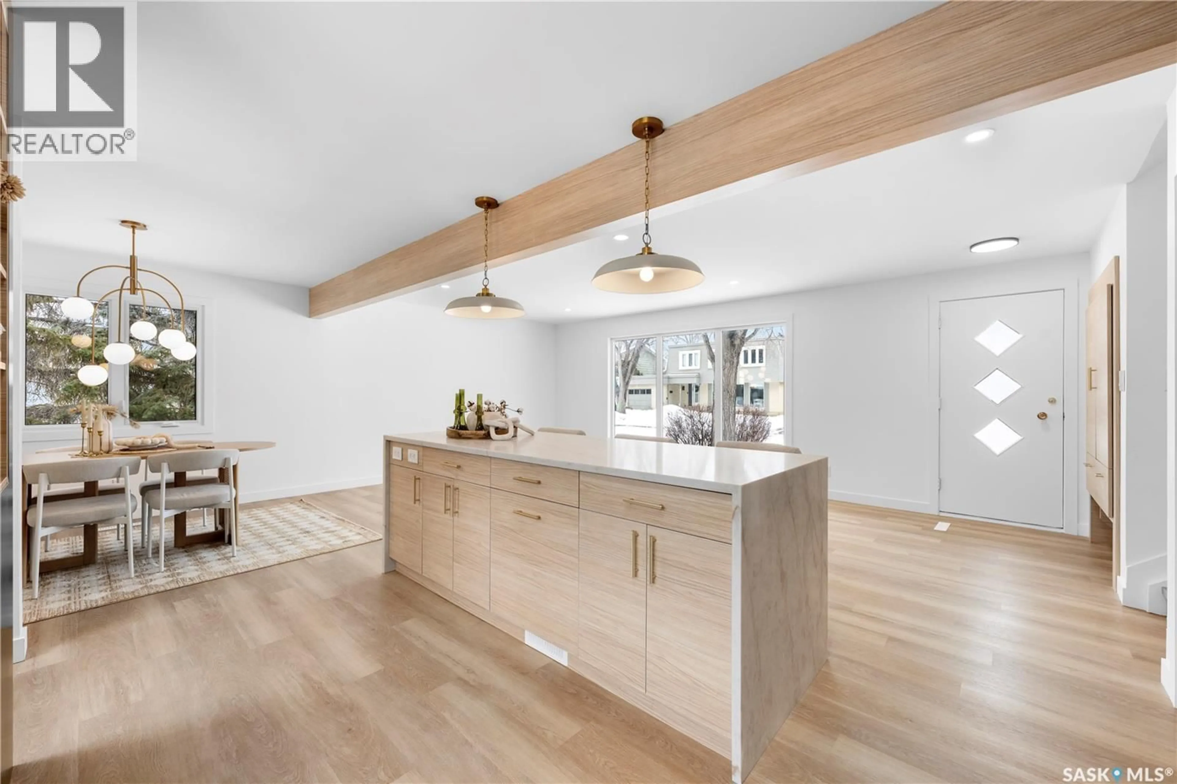 Open concept kitchen, wood/laminate floor for 73 TIBBITS ROAD, Regina Saskatchewan S4S1N5