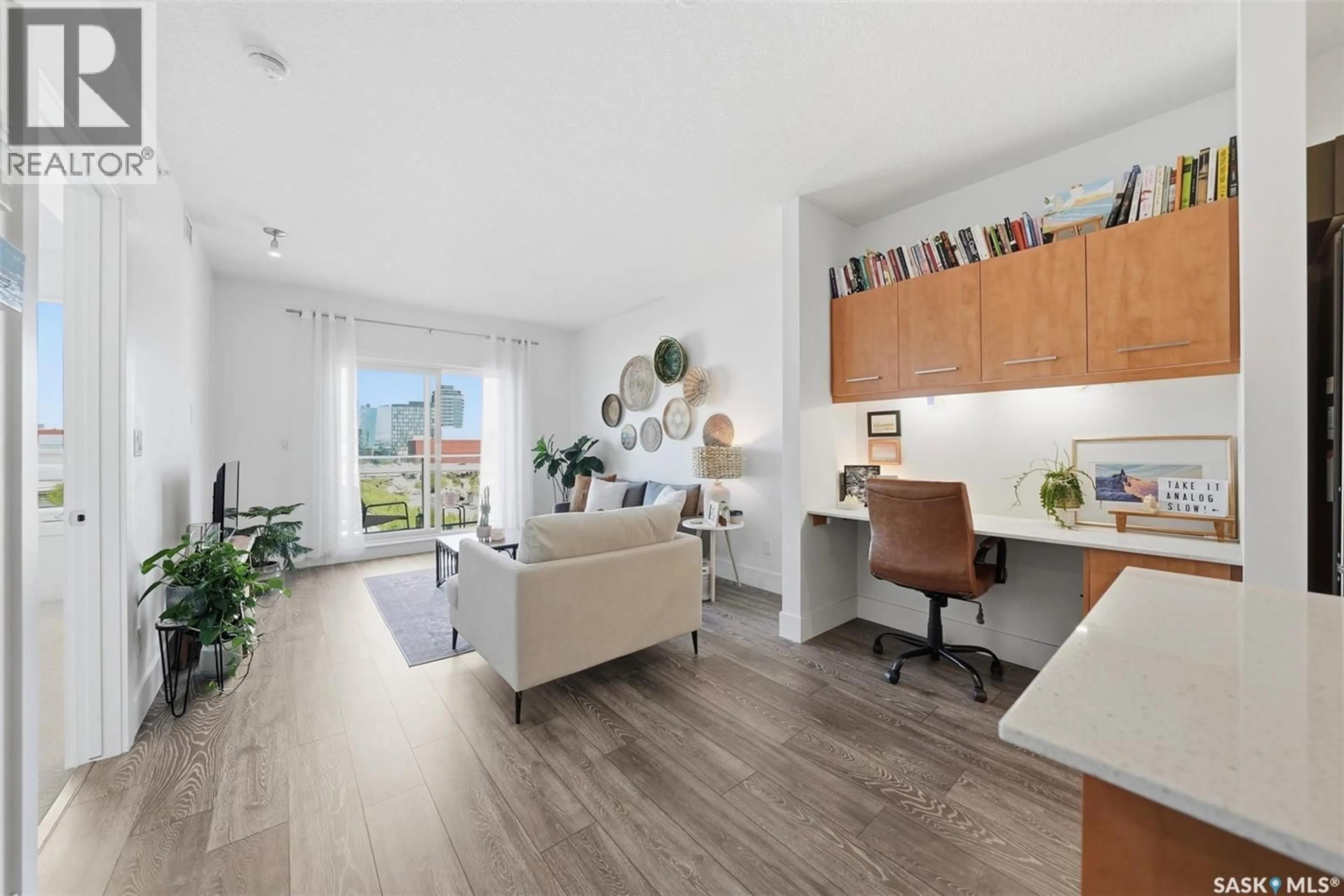 Living room with furniture, wood/laminate floor for 409 - 409 B AVENUE, Saskatoon Saskatchewan S7M5M8