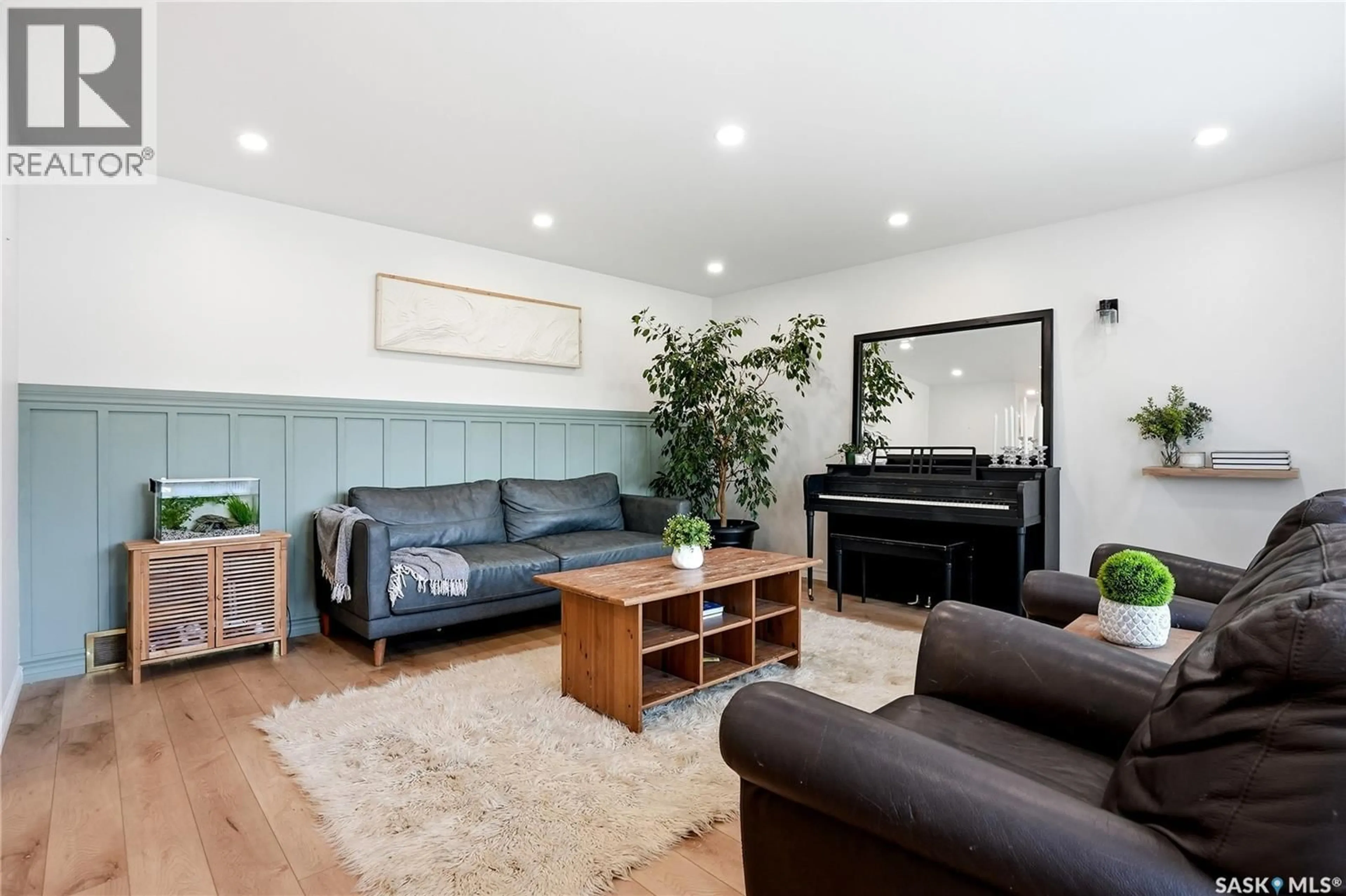 Living room with furniture, wood/laminate floor for 21 POTTER CRESCENT, Saskatoon Saskatchewan S7H3O2
