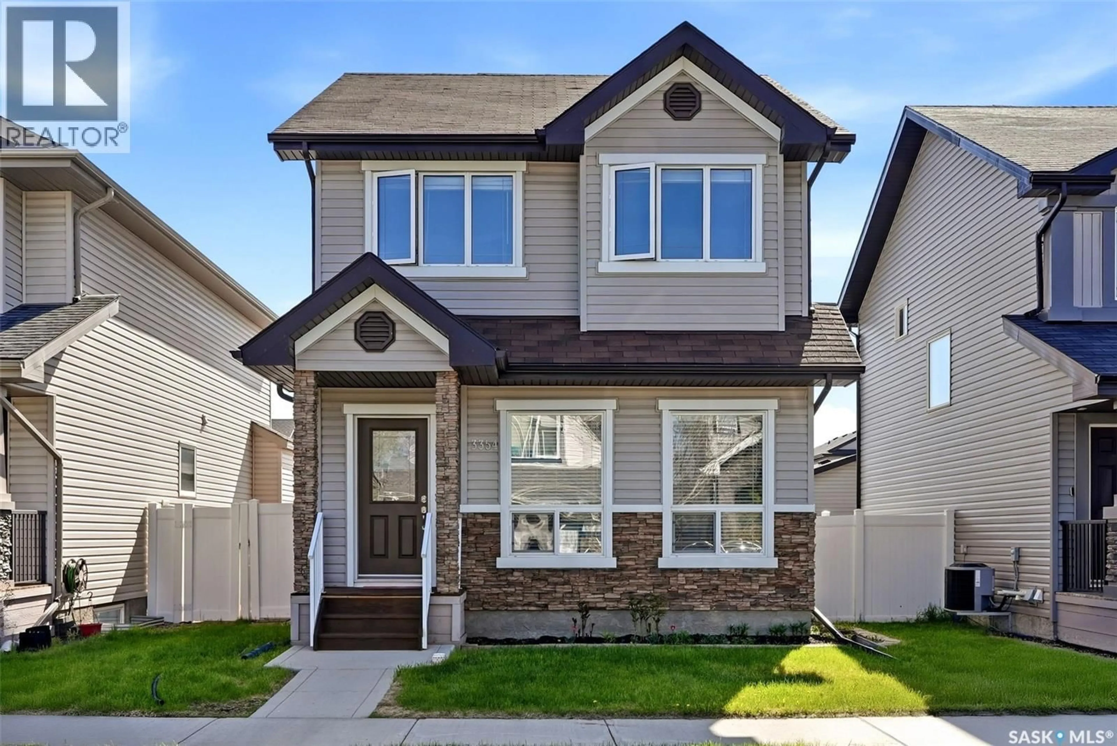 Home with brick exterior material, street for 3354 GREEN MOSS LANE, Regina Saskatchewan S4V1P2