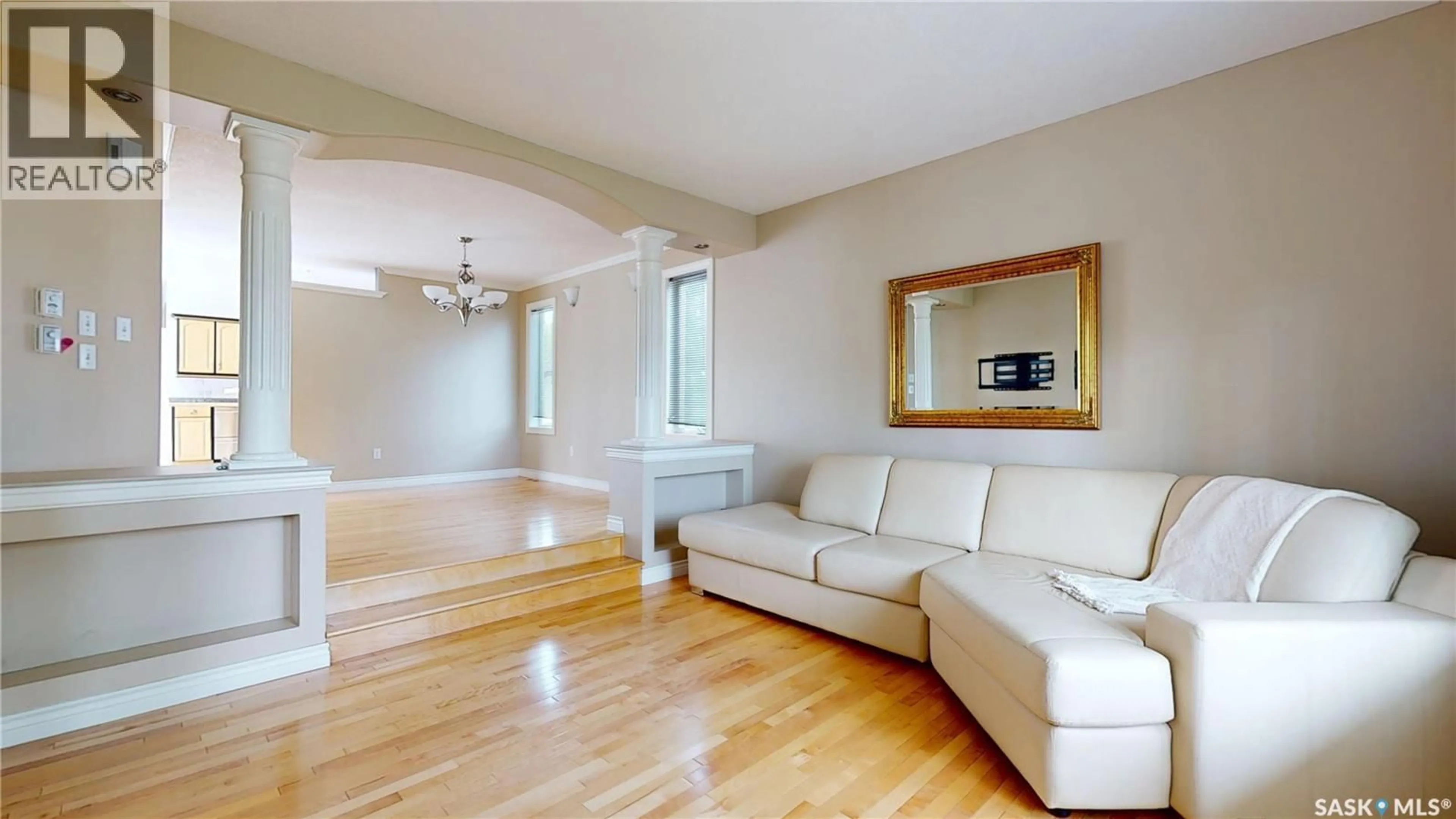 Living room with furniture, wood/laminate floor for 1358 FORGET STREET, Regina Saskatchewan S4T4Y1