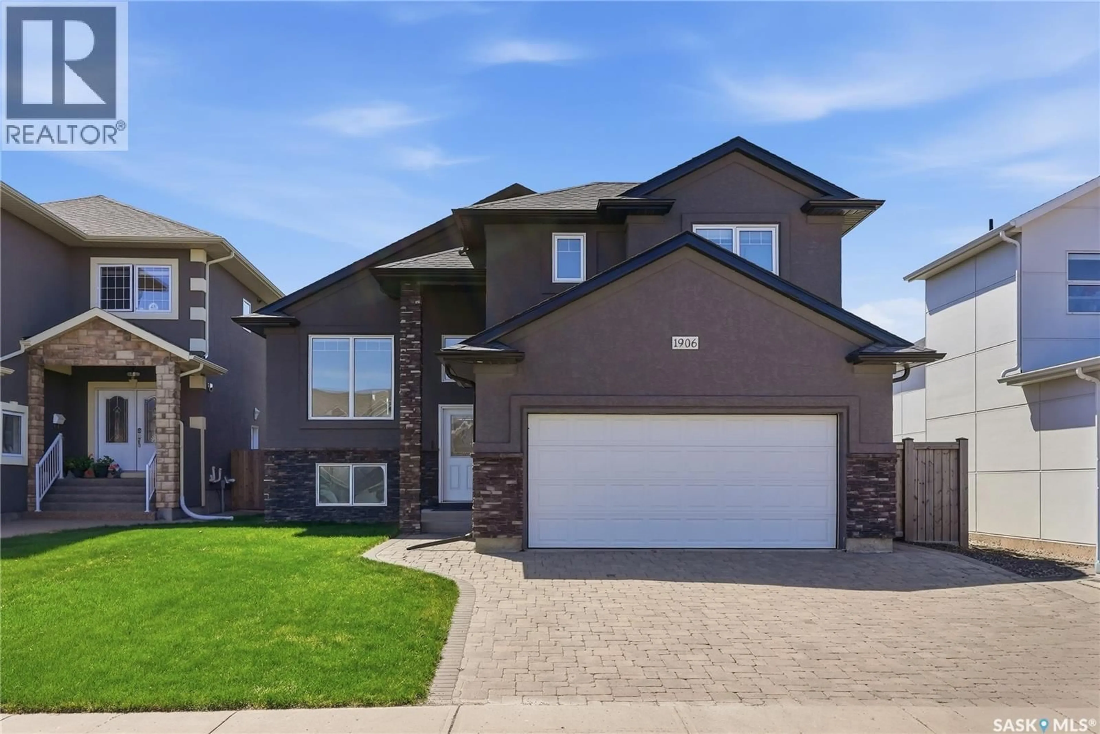 Home with brick exterior material, street for 1906 POHORECKY TERRACE, Saskatoon Saskatchewan S7W0J1