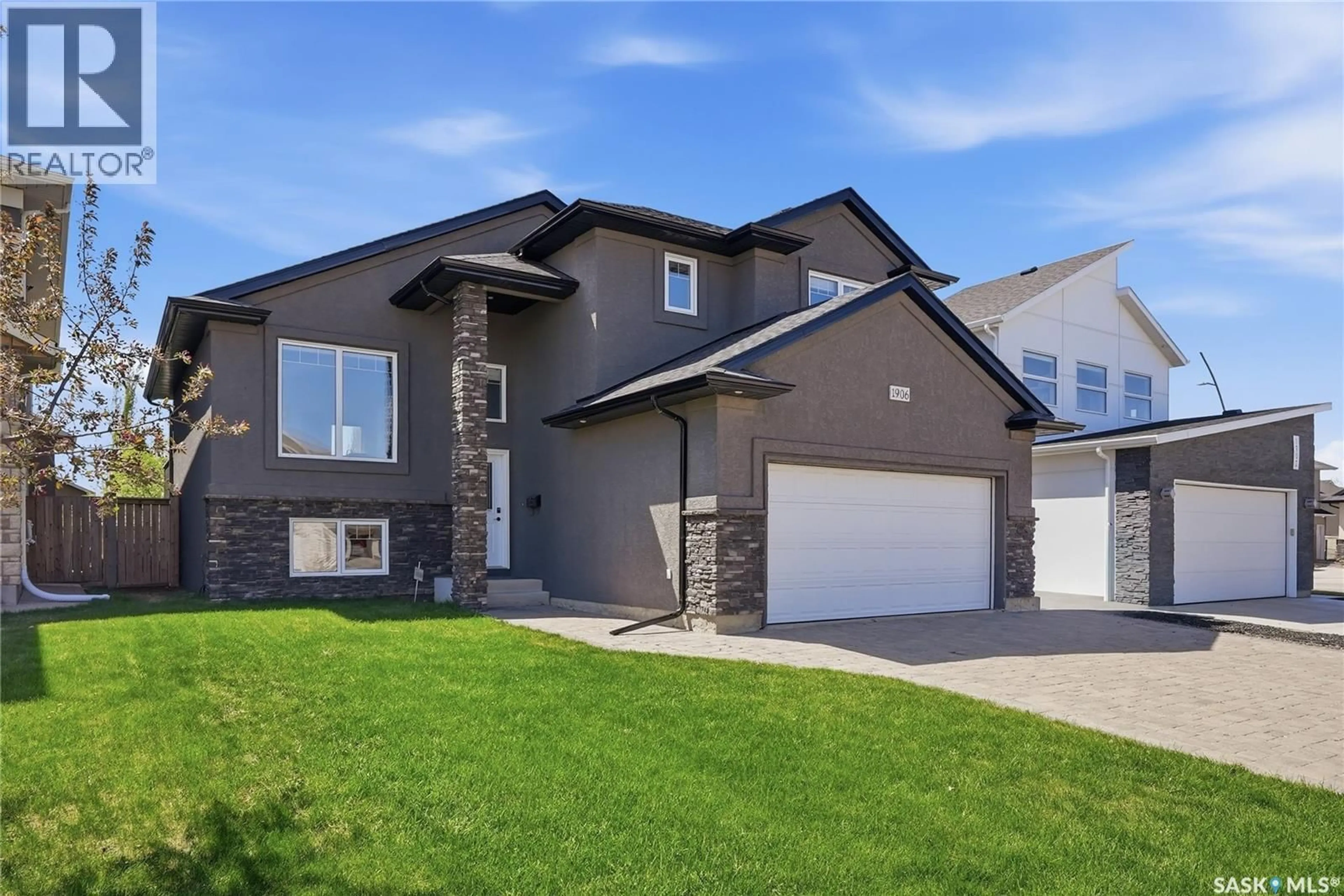 Home with brick exterior material, street for 1906 POHORECKY TERRACE, Saskatoon Saskatchewan S7W0J1