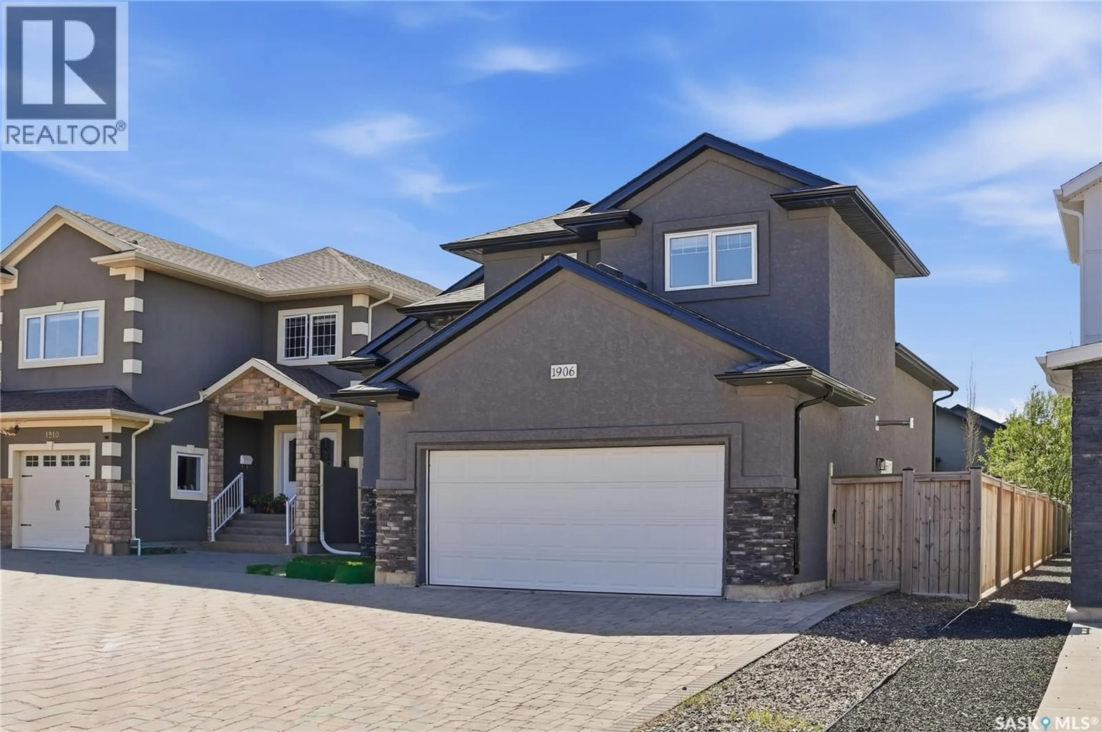 Home with vinyl exterior material, street for 1906 POHORECKY TERRACE, Saskatoon Saskatchewan S7W0J1